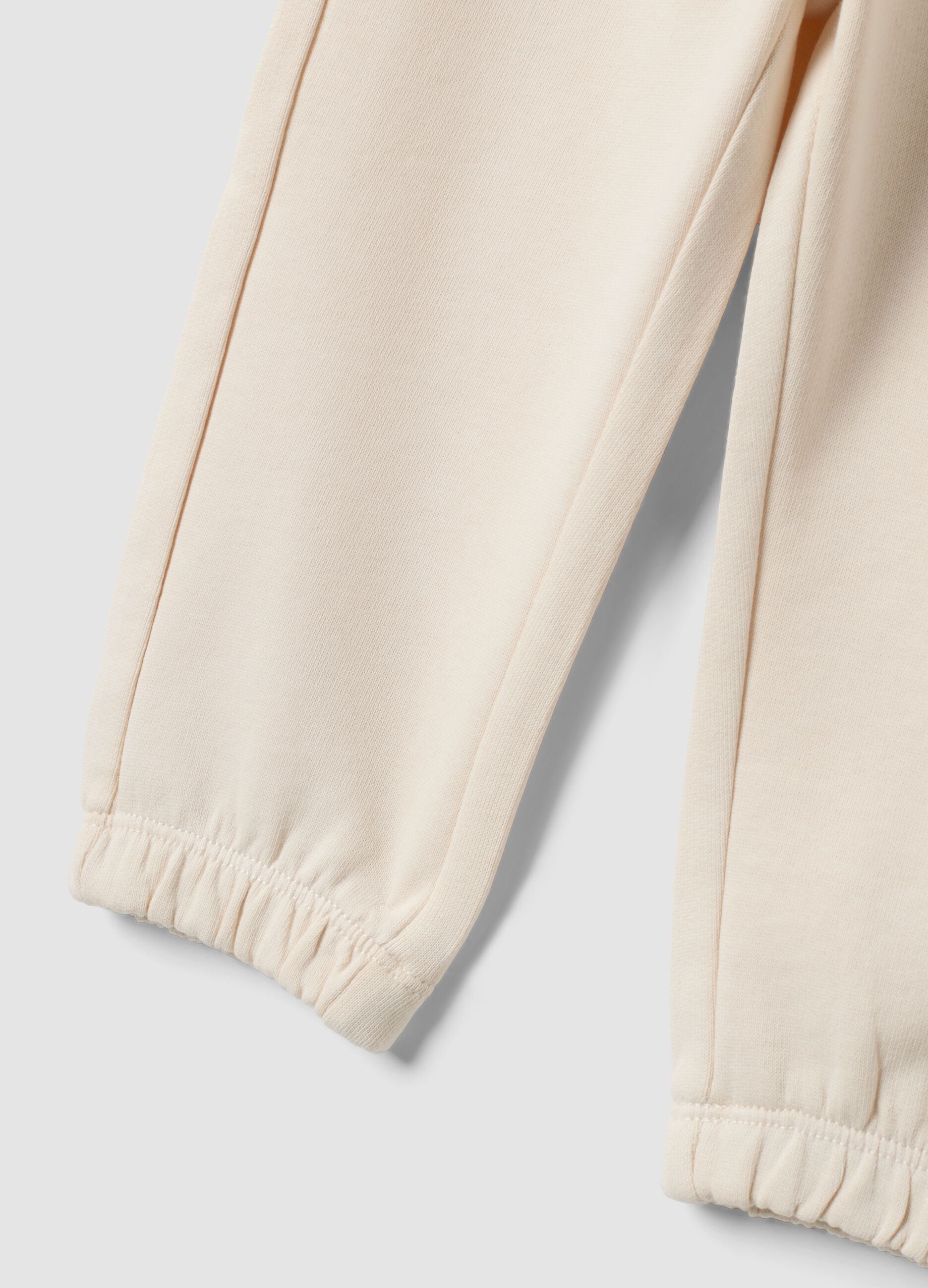 White pure cotton jogger trousers for baby girl