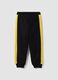 Black 100% cotton kids&rsquo; tracksuit bottoms with yellow side stripes_1