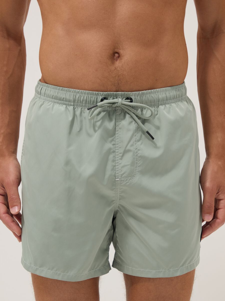 Green swim shorts with elasticated waistband and drawstring_2