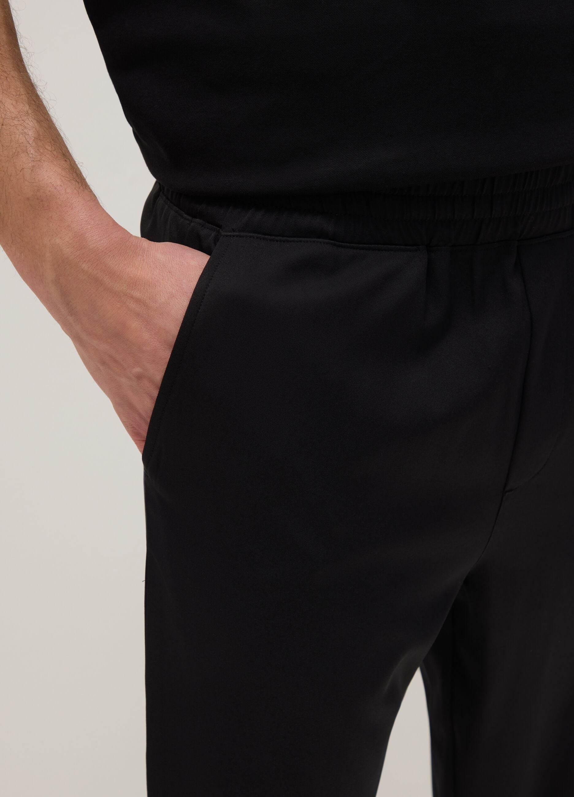Black regular fit trousers with elasticated waist