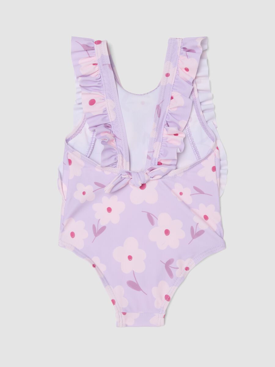 Costume intero viola in tessuto elasticizzato con volant_1