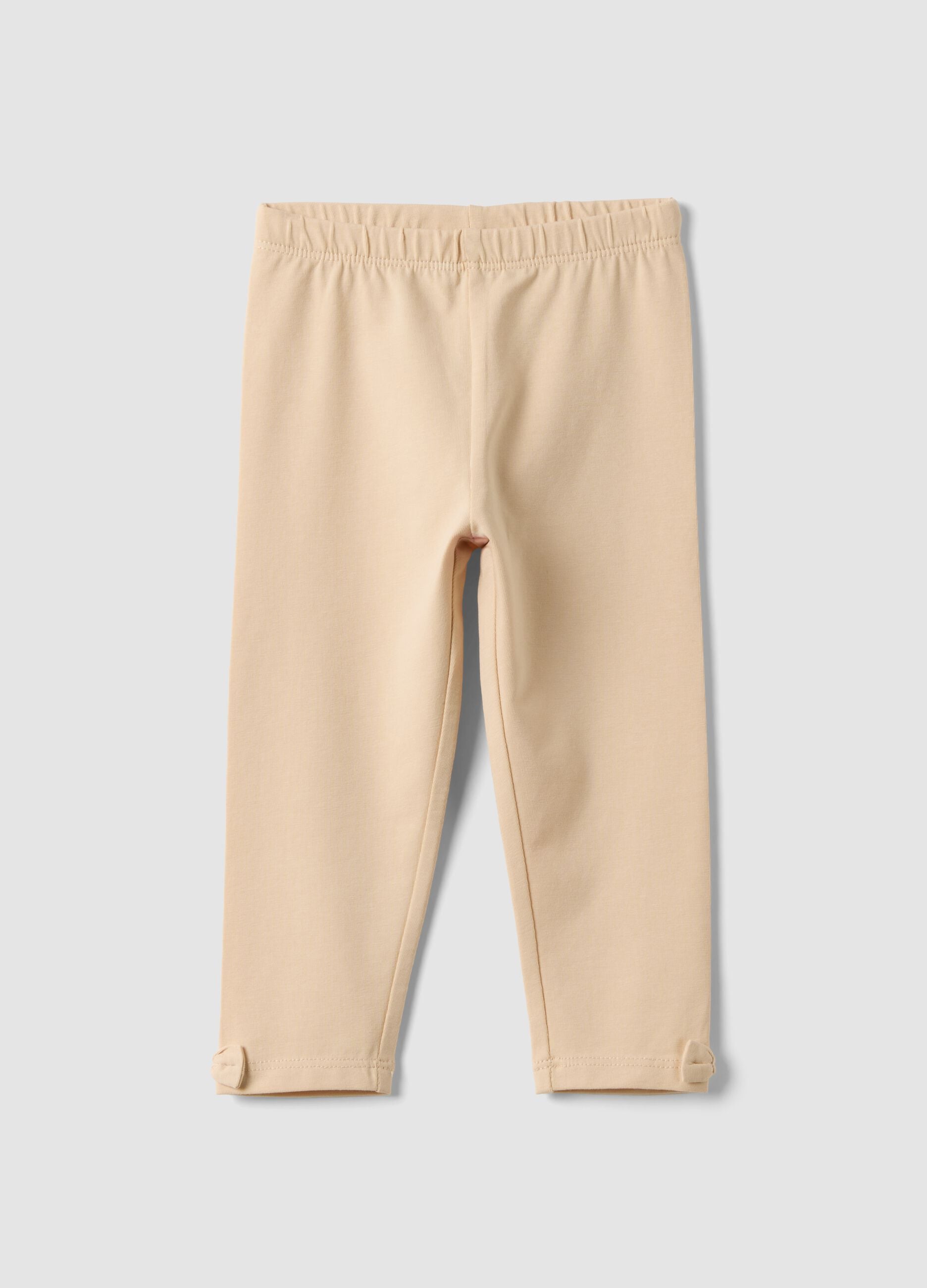 Beige stretch organic cotton leggings with bows for baby girl