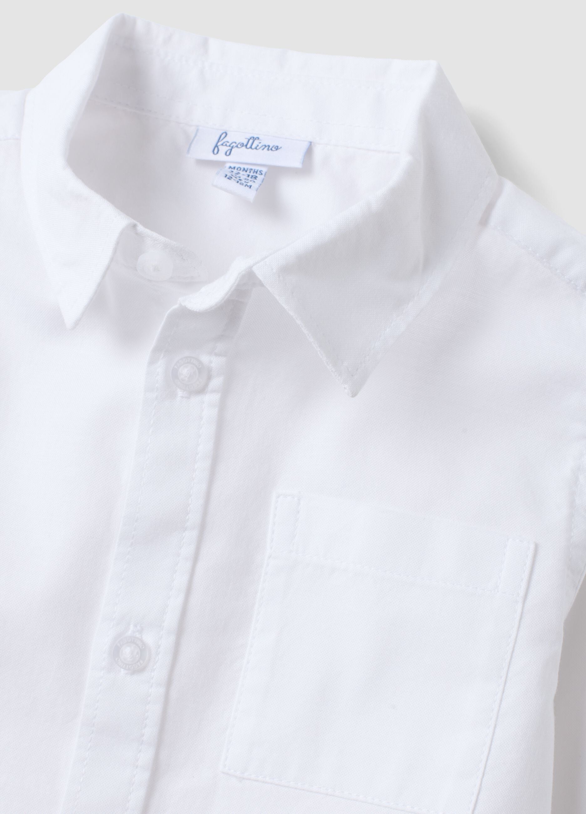 White pure cotton shirt with classic collar and chest pocket for baby boy