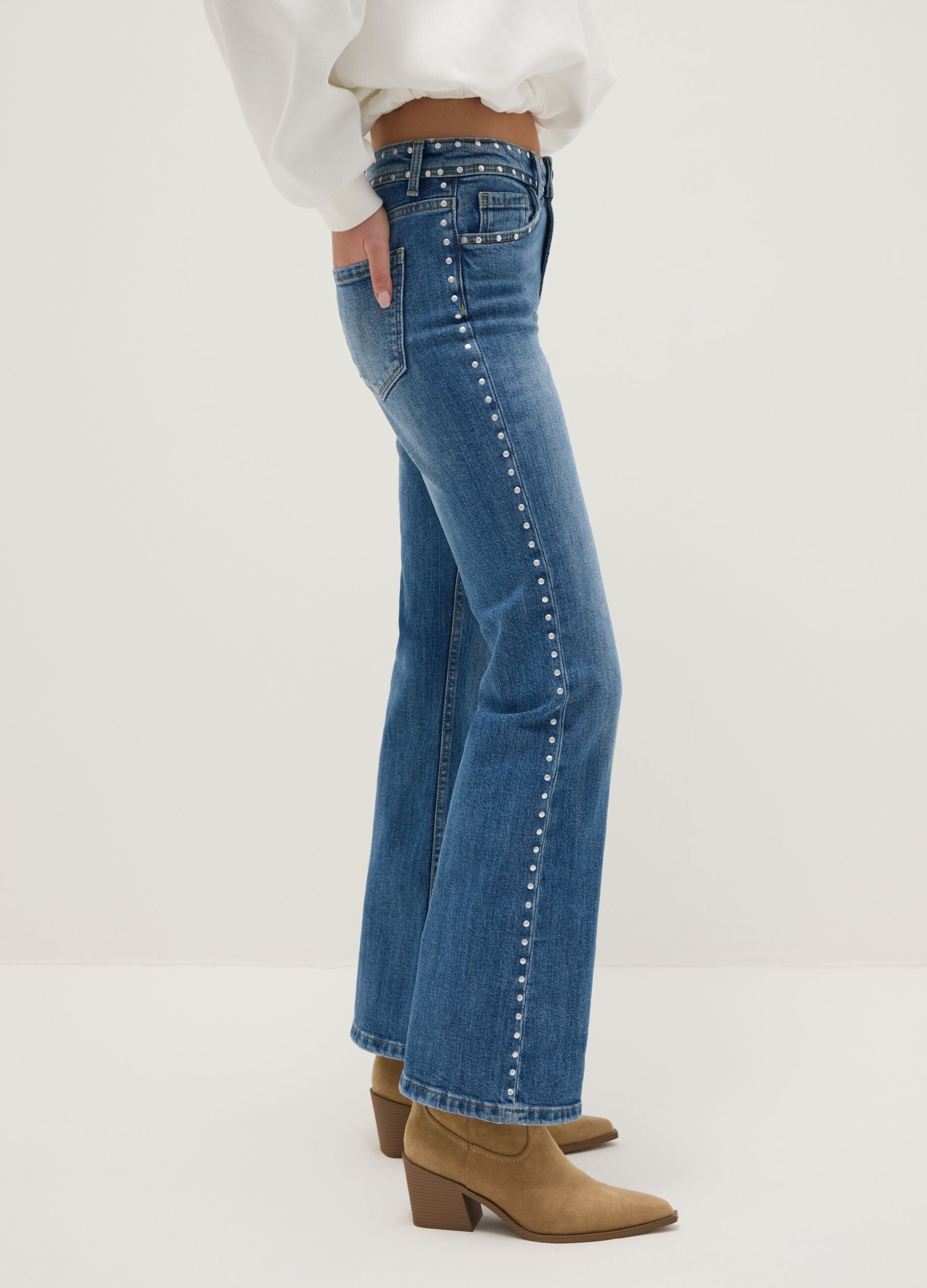 Blue denim bootcut jeans with studs