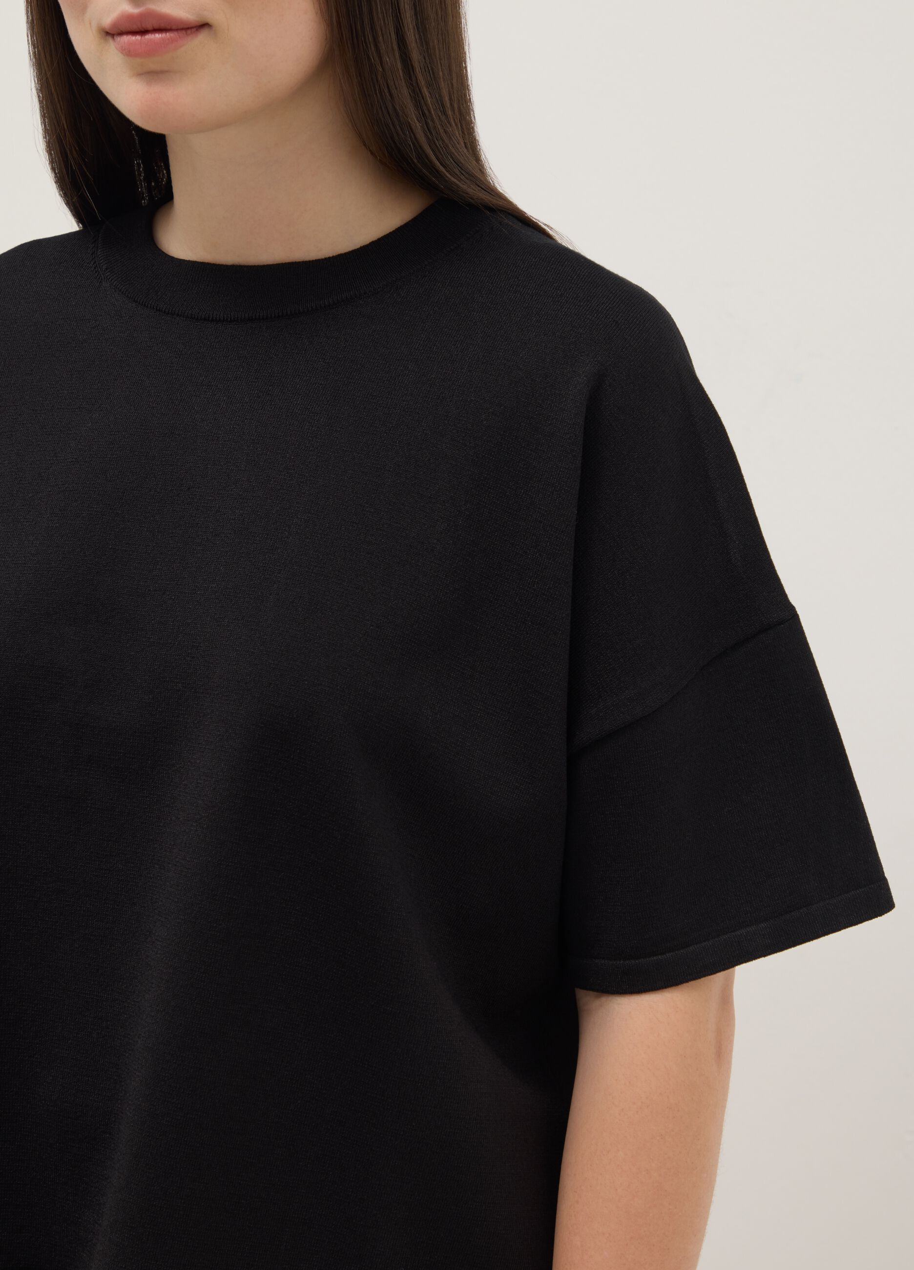Black oversized crop top with round neckline