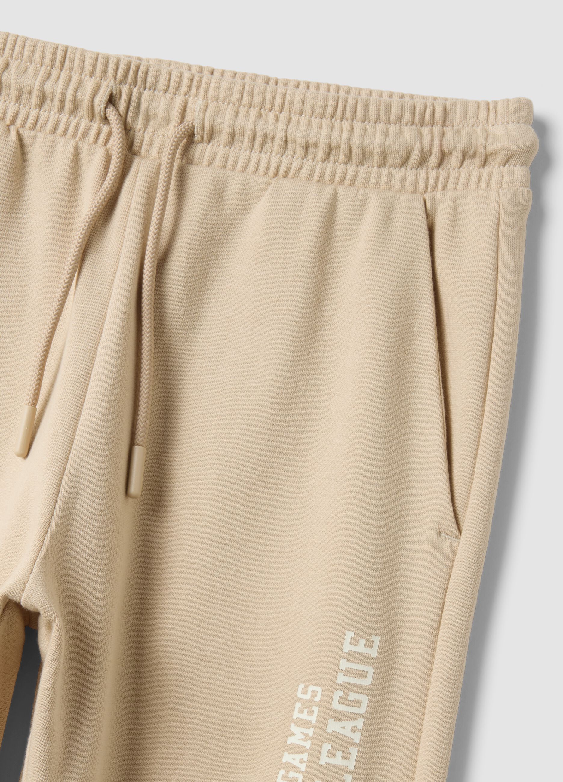Beige pure cotton joggers with print for boys