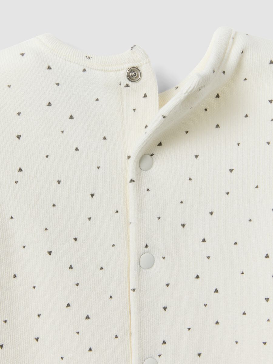 White organic cotton baby romper with buttons and pattern_3