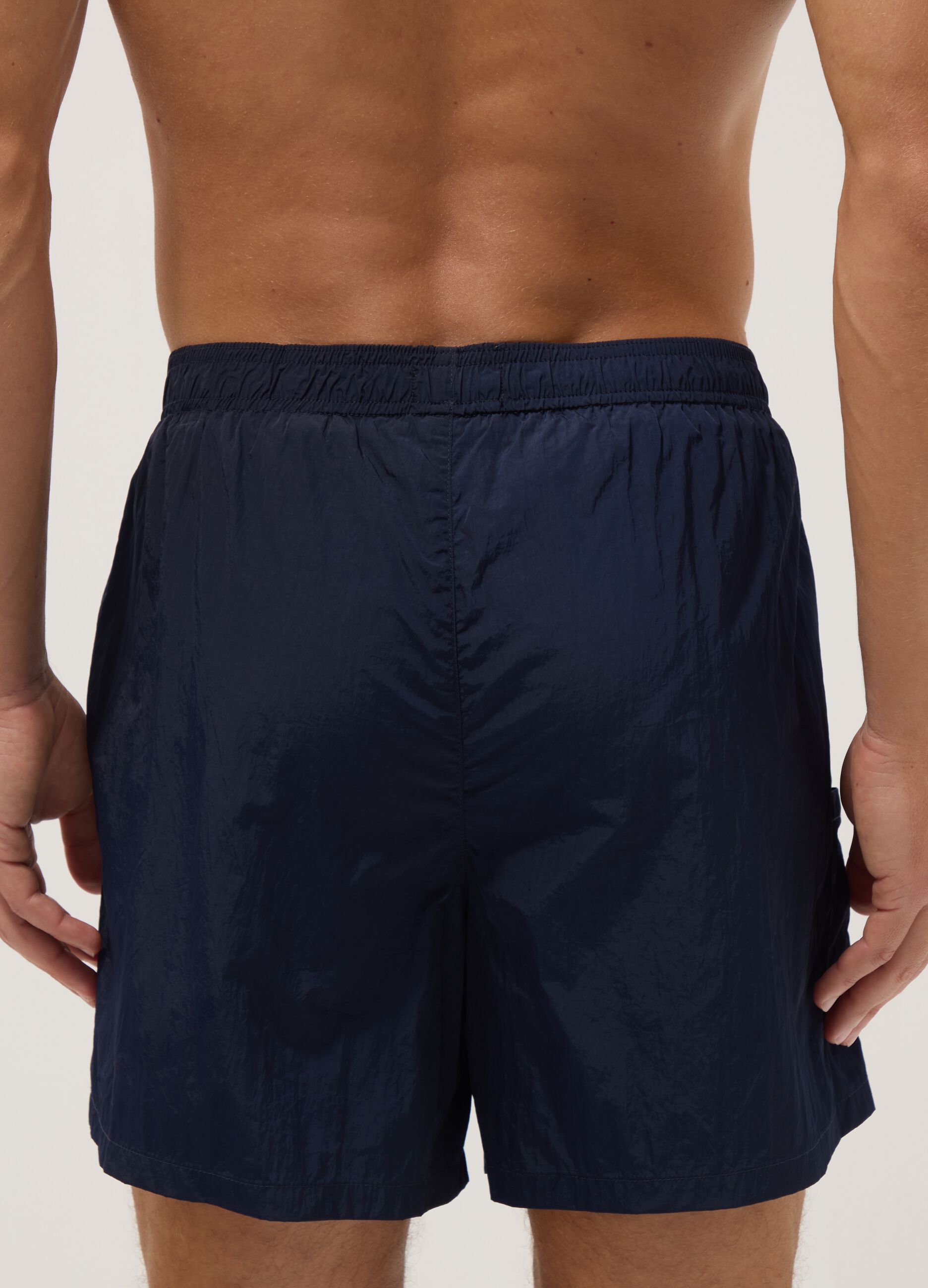 Blue swim shorts with elasticated waistband