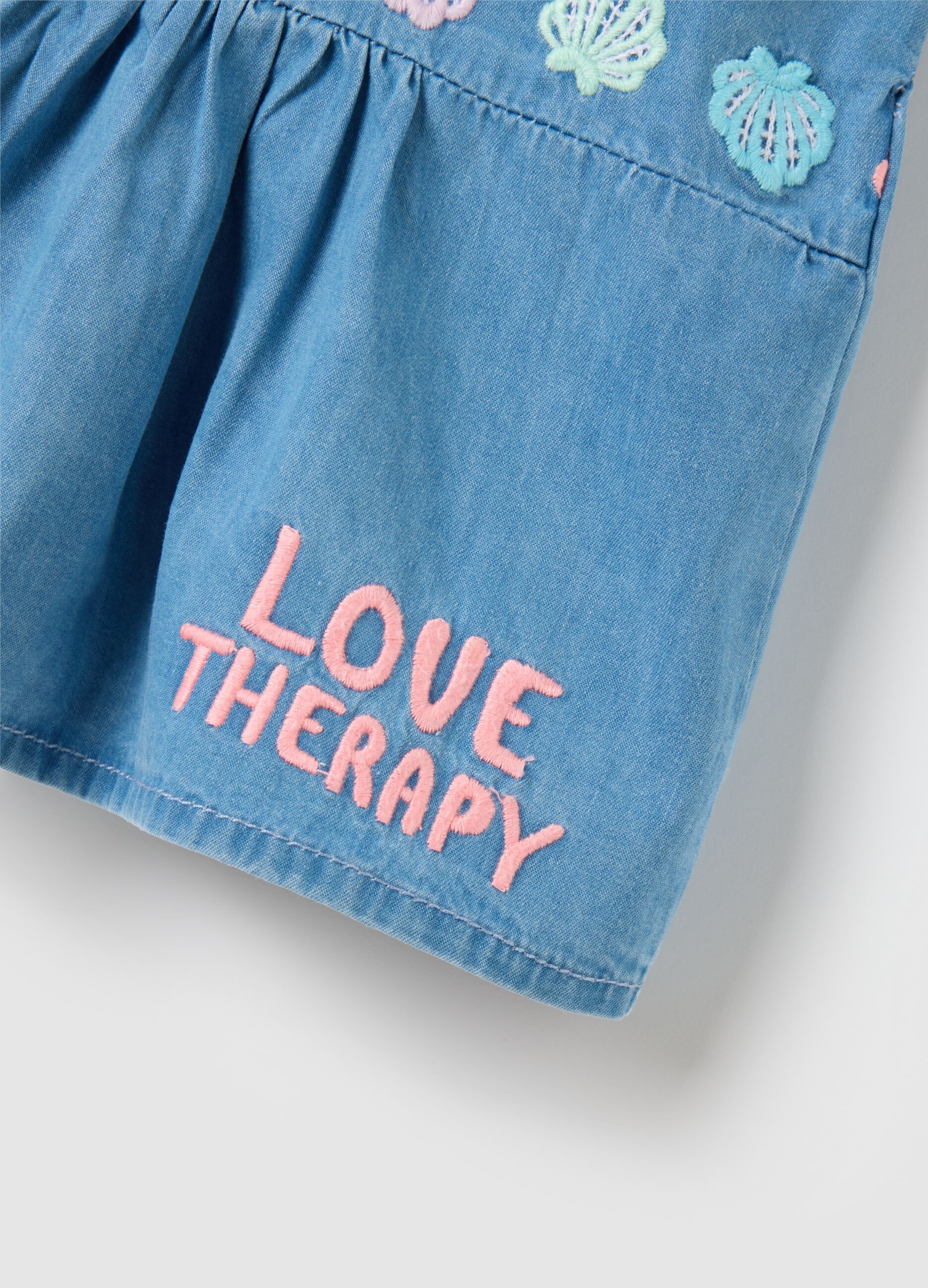 Sleeveless chambray top with embroidery
