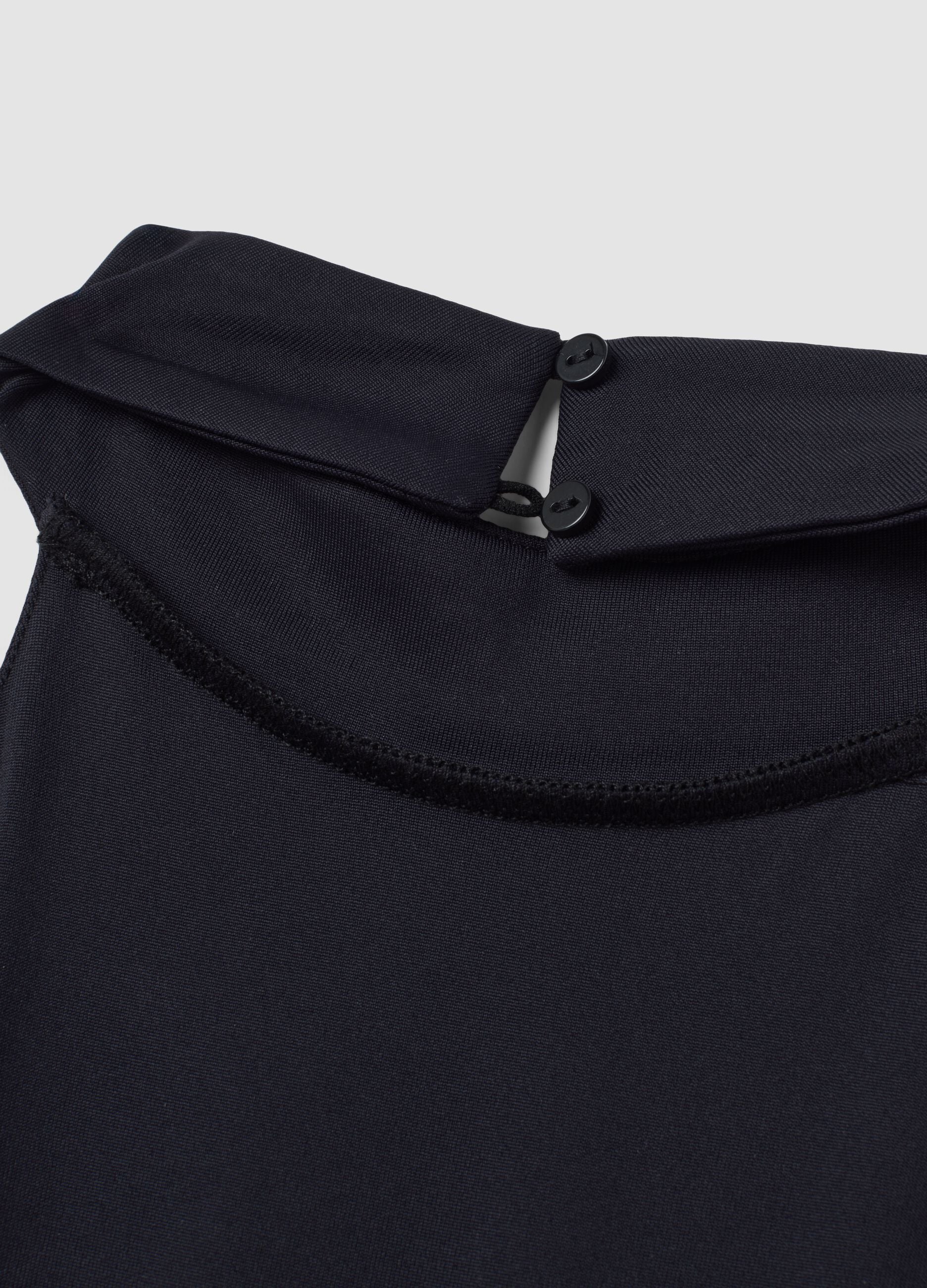 Black stretch dress with high neck and ruffle hem