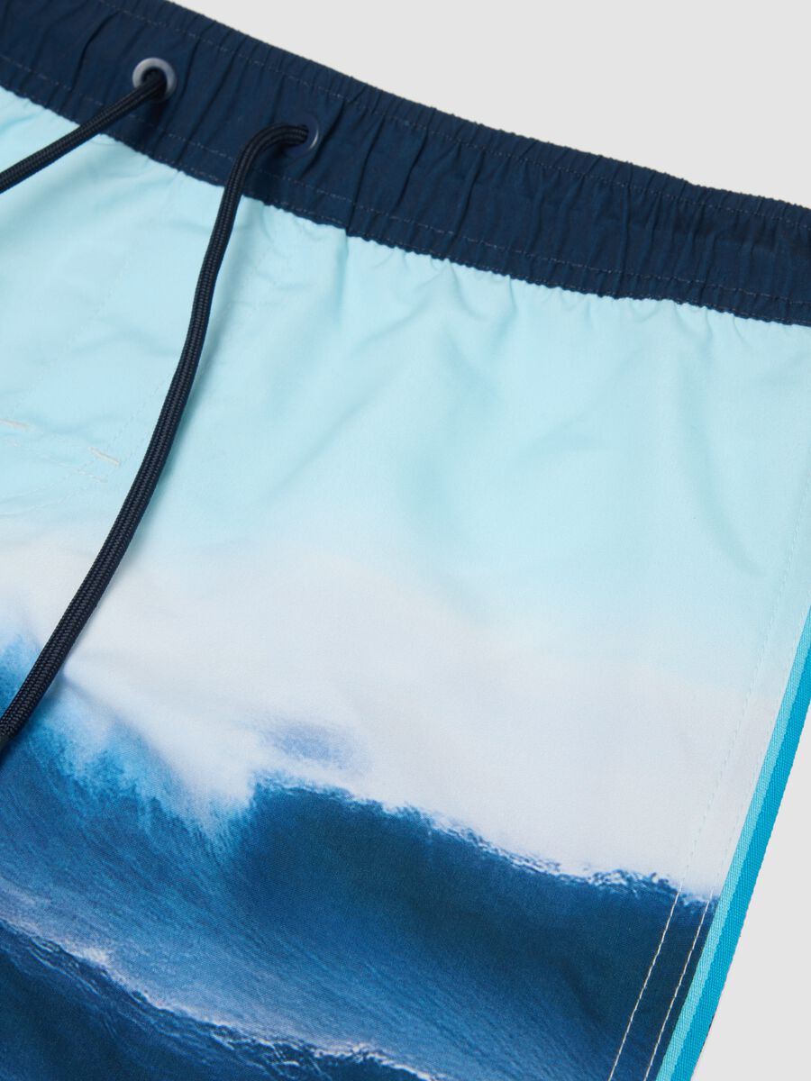 Blue boys&rsquo; swim shorts with wave print_2