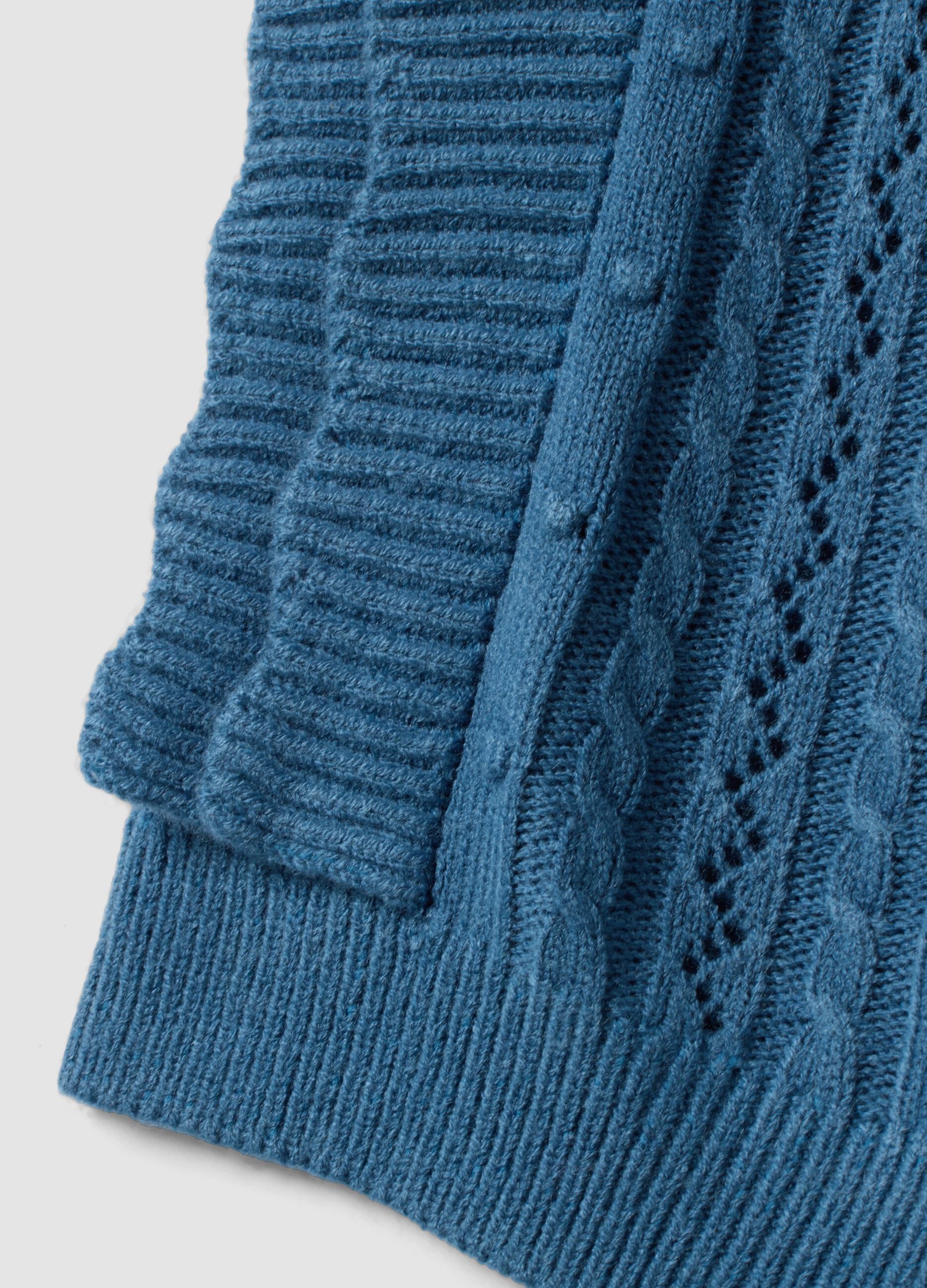 Blue knitted gilet with ruffles and cable knit