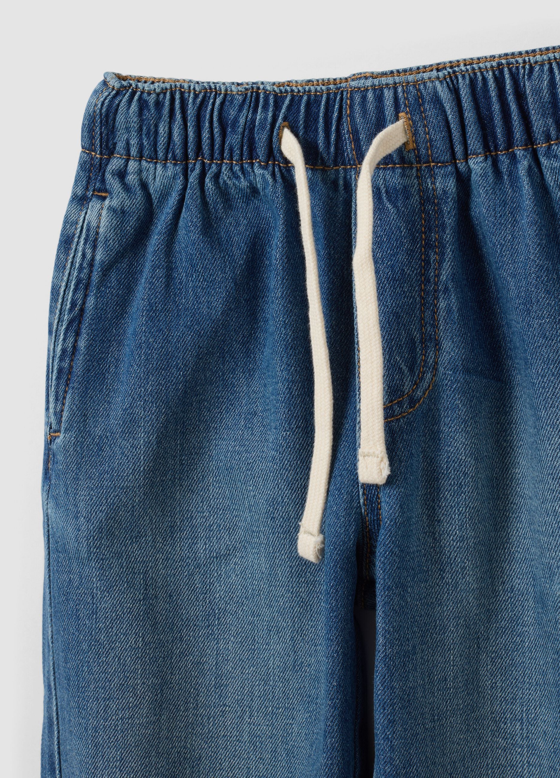 Light blue denim joggers in cotton-viscose blend with cargo pockets, relaxed fit