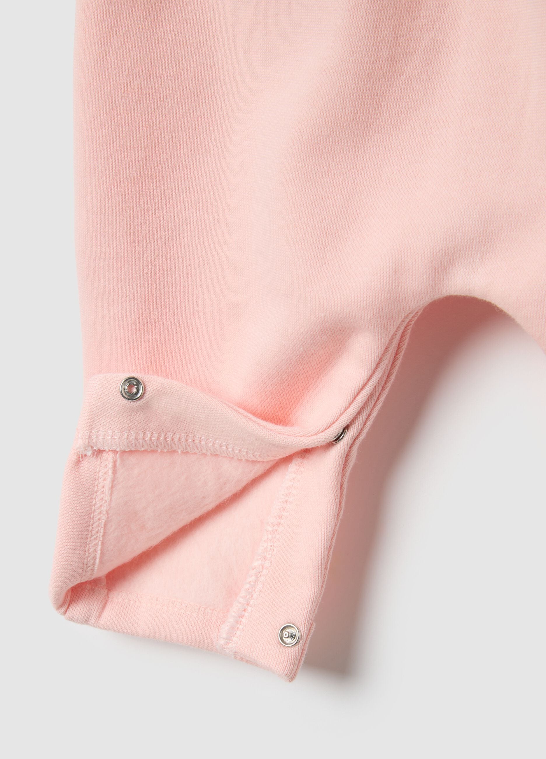 Baby girl's pink cotton sleepsuit with embroidered details