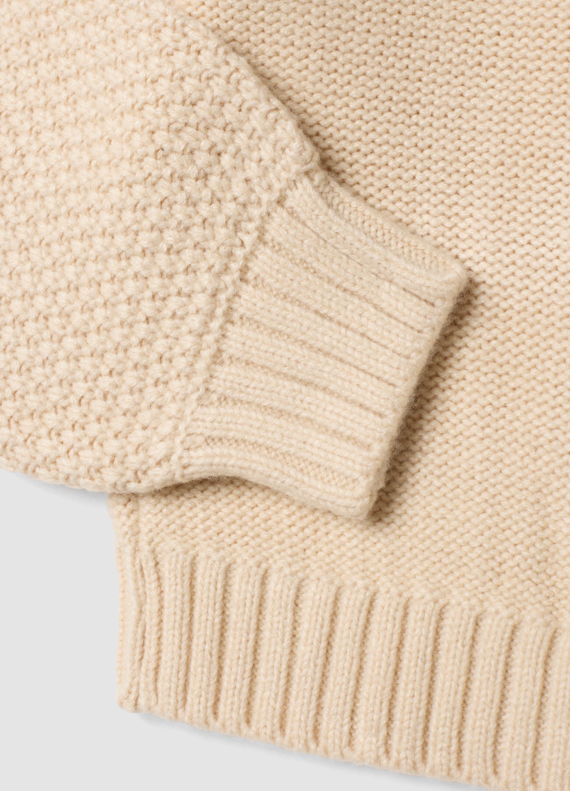 Beige knitted cardigan with deep V-neck