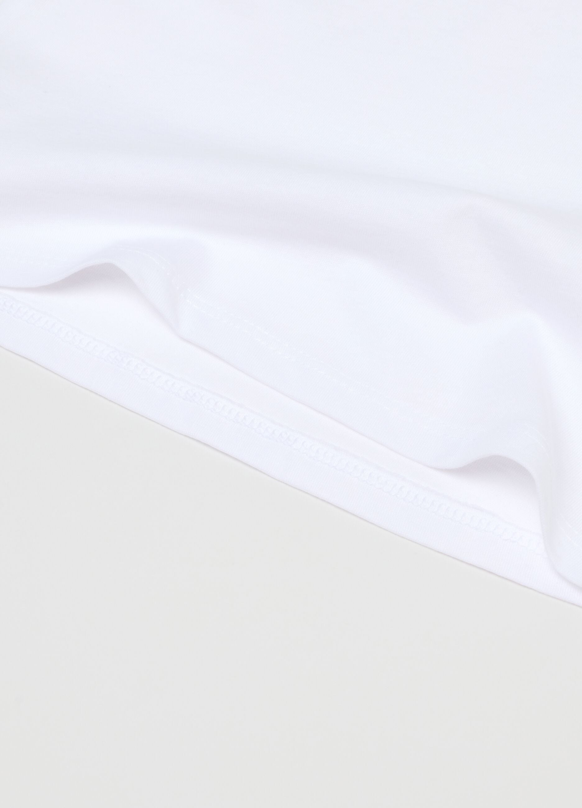 Pack of white girl's vests in pure cotton regular fit
