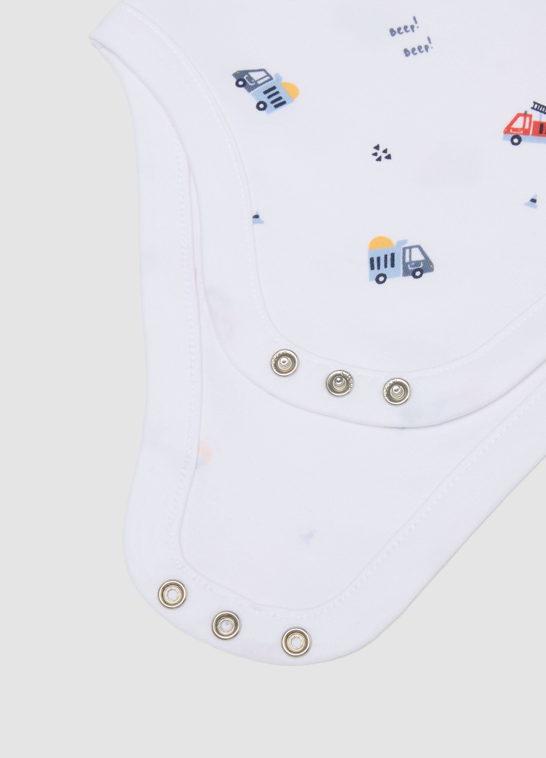 3-pack of blue and white organic cotton baby bodysuits with cars