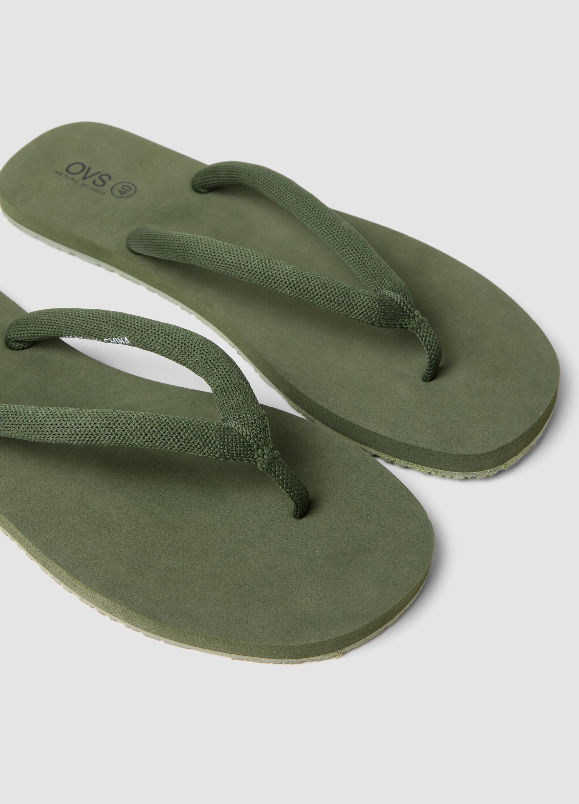 Green flip-flops with thick straps