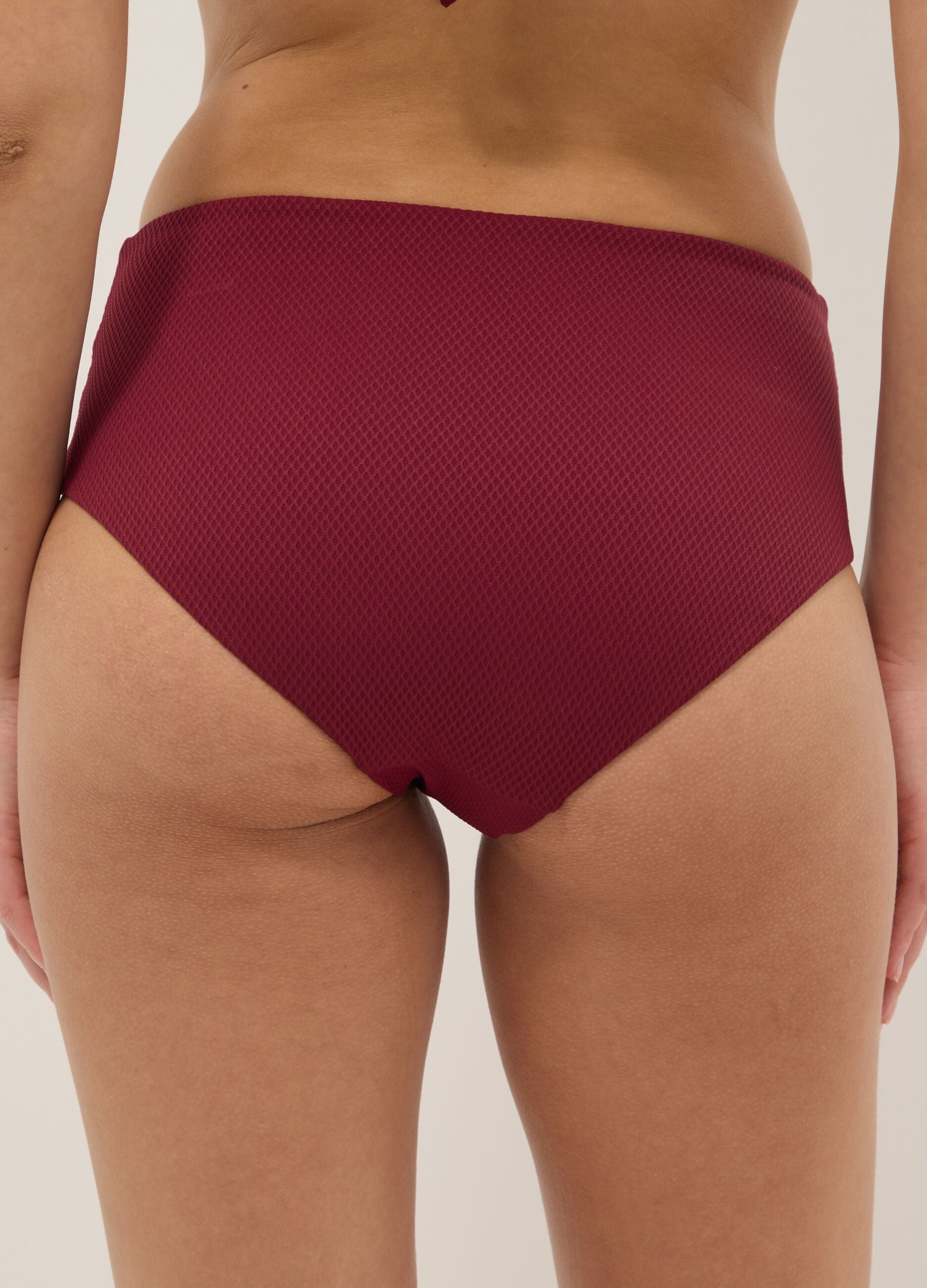 Red high-waisted stretchy bikini bottoms with buckle