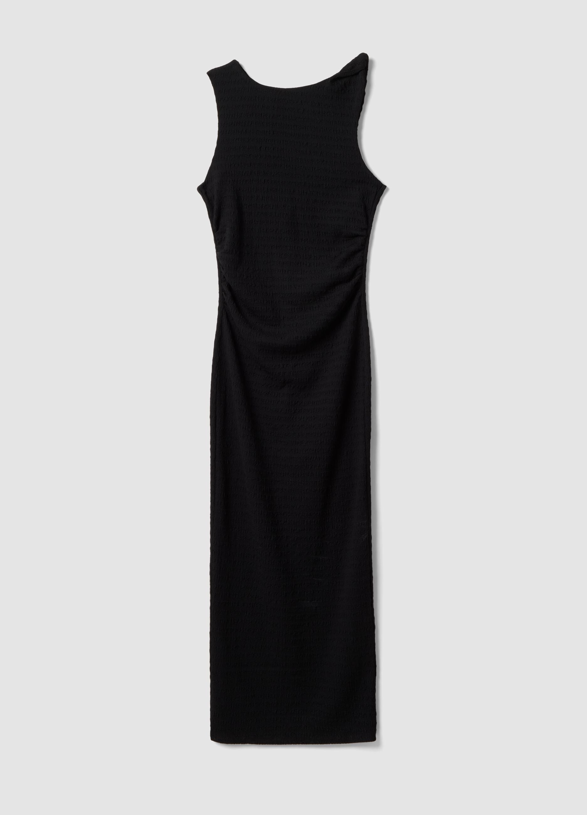 Black fitted sleeveless dress with back slit