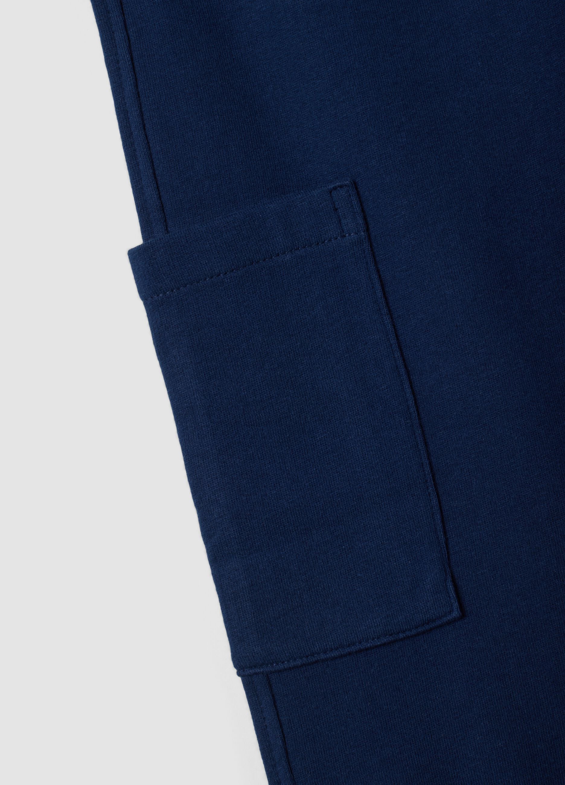 Blue organic cotton jogger trousers with cargo pockets for boys