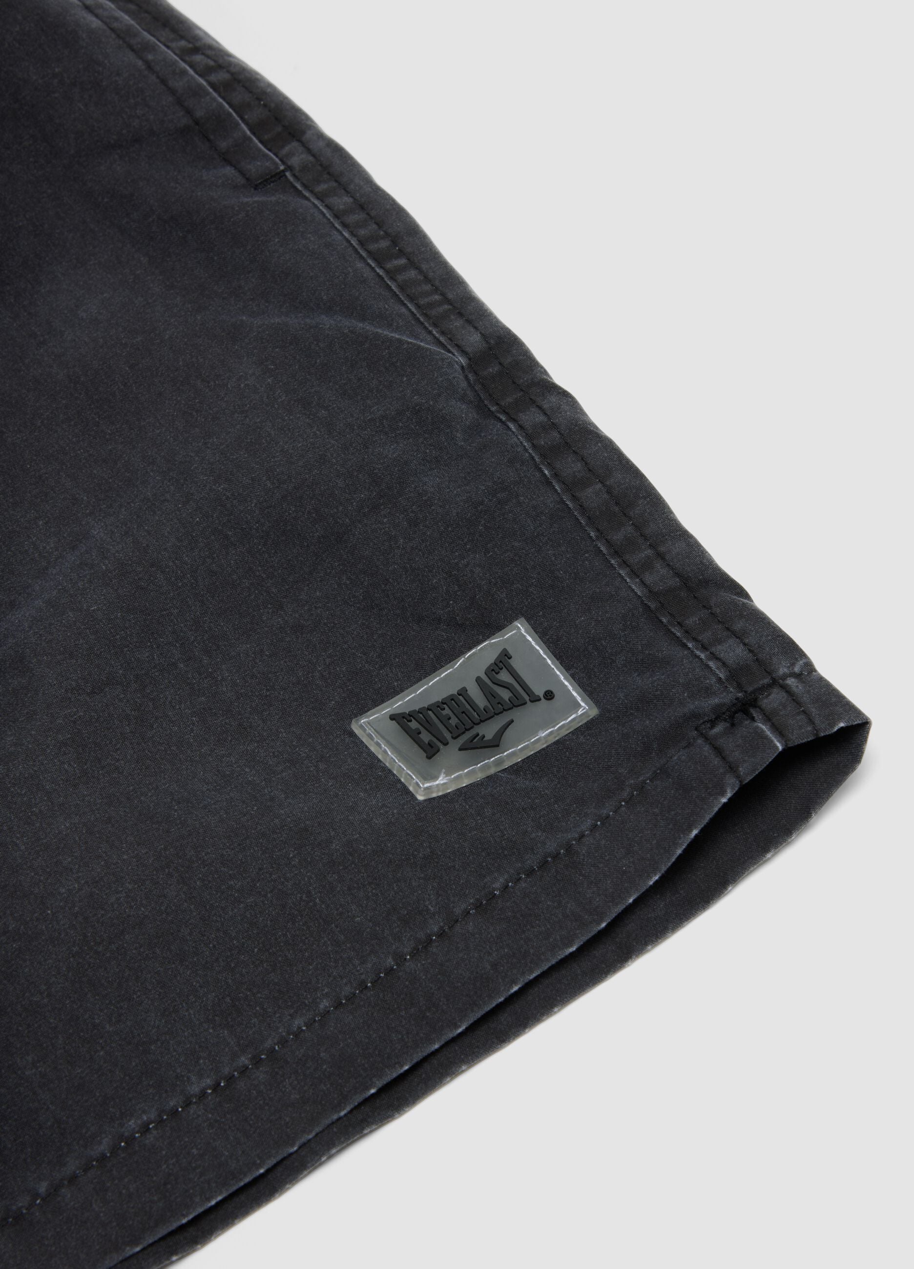 Black swim shorts with drawstring waist