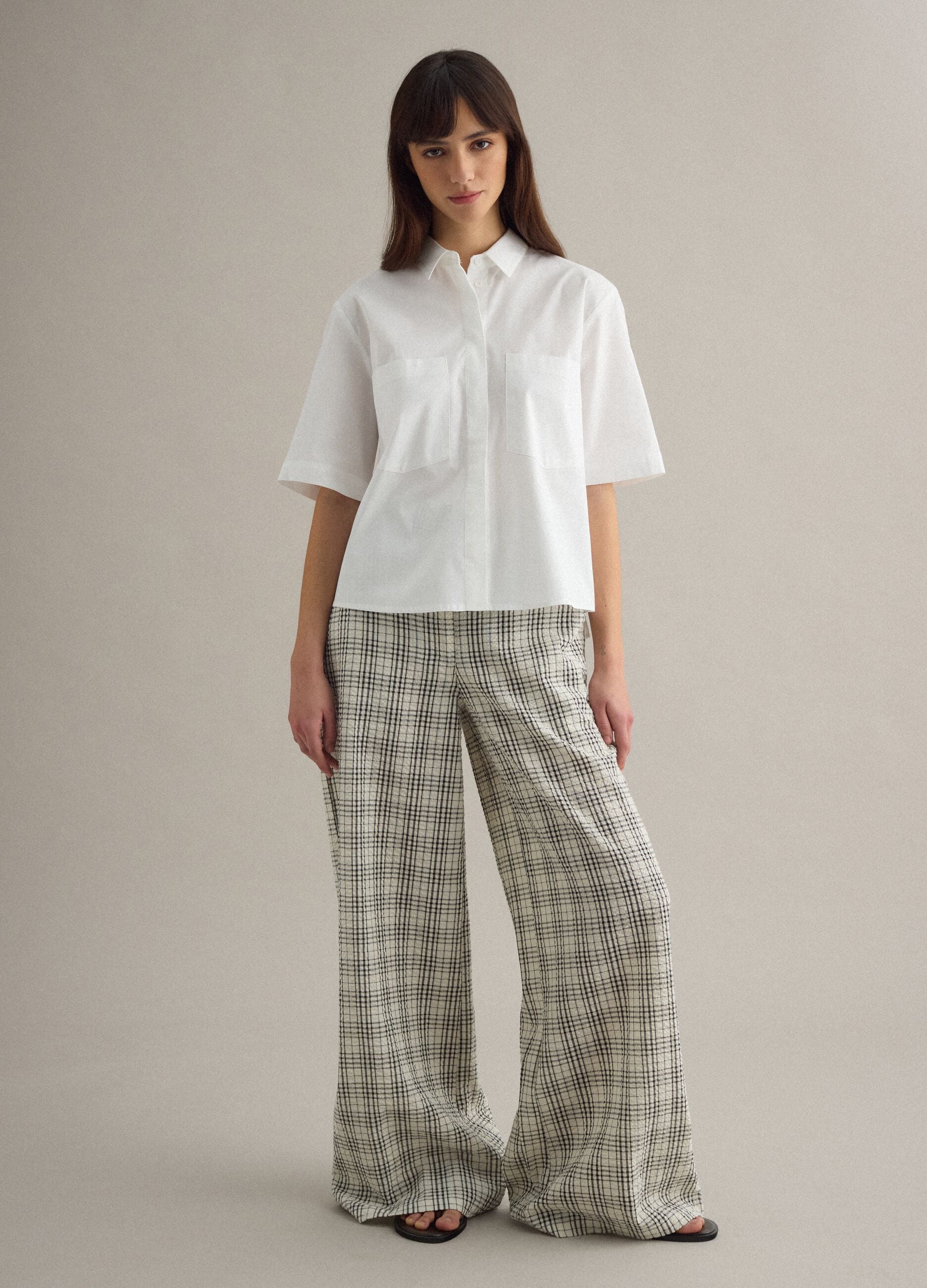 White stretch cotton oversized fit shirt with small pockets