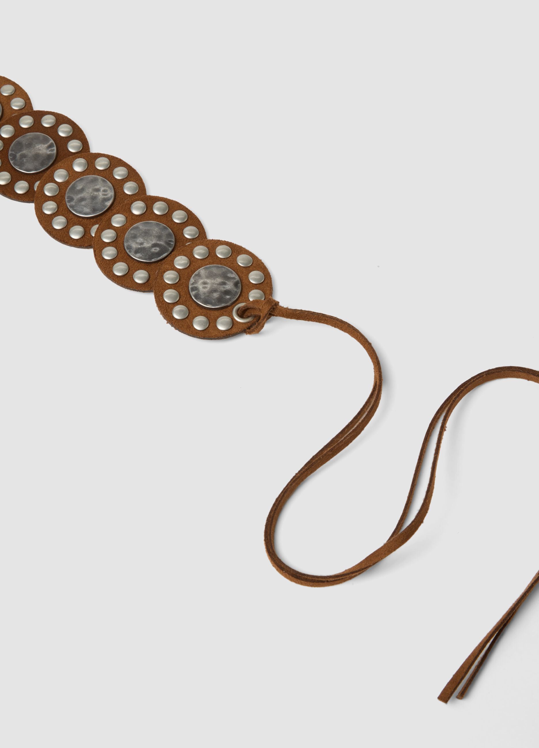 Brown belt with decorative discs and ties