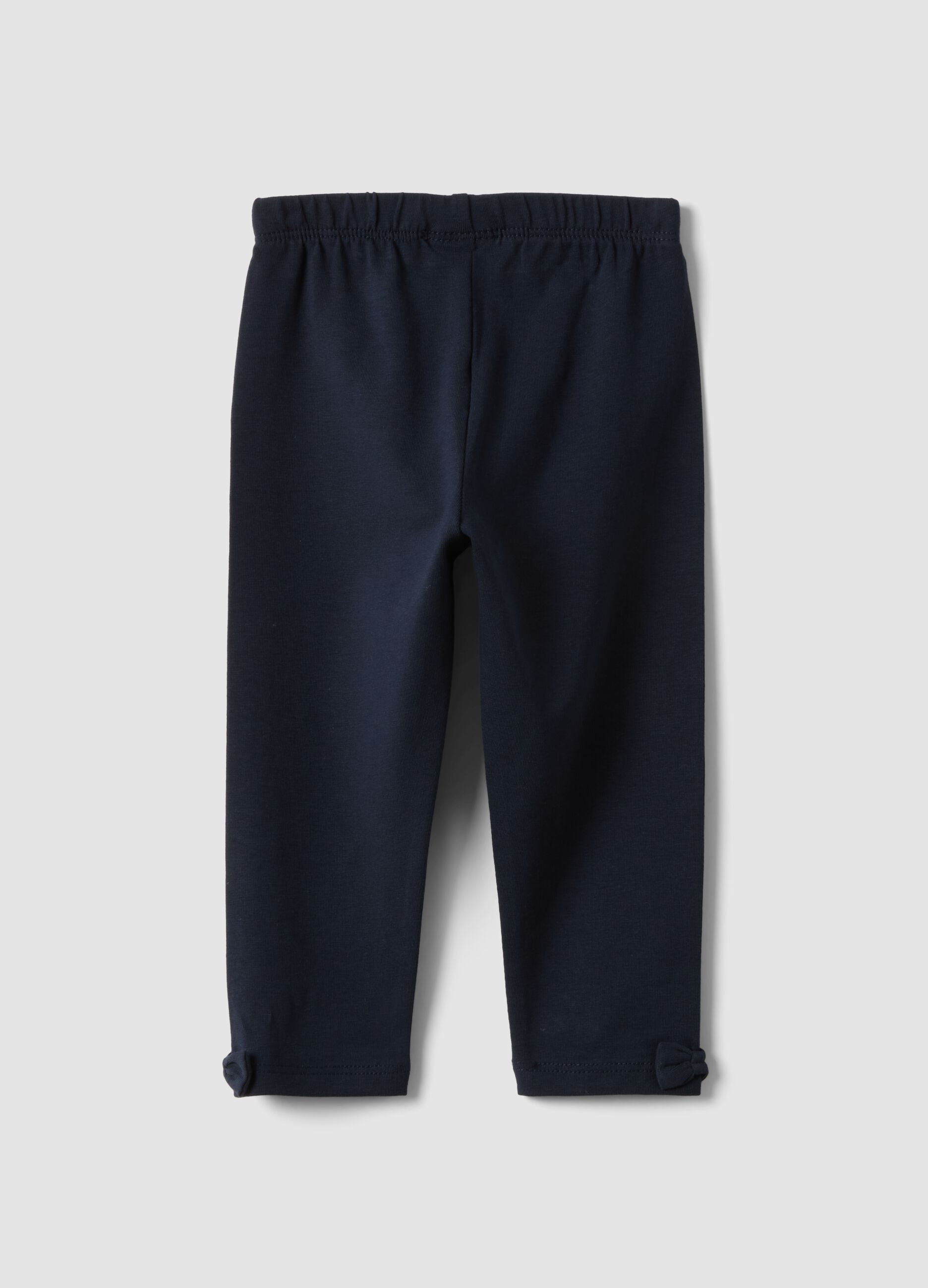 Blue stretch organic cotton leggings with bows for baby girl