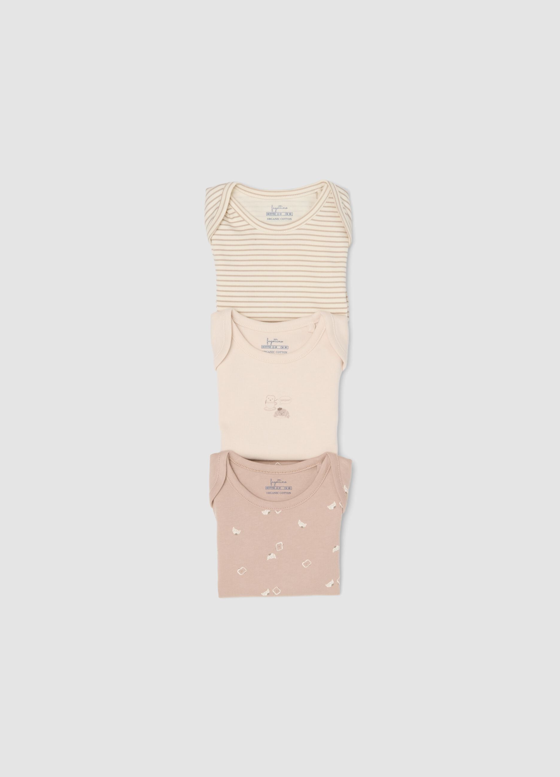 3-pack of pink and beige organic cotton short-sleeve bodysuits for babies and toddlers