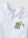 Customisable white nursery apron with zip and dinosaur embroidery_2