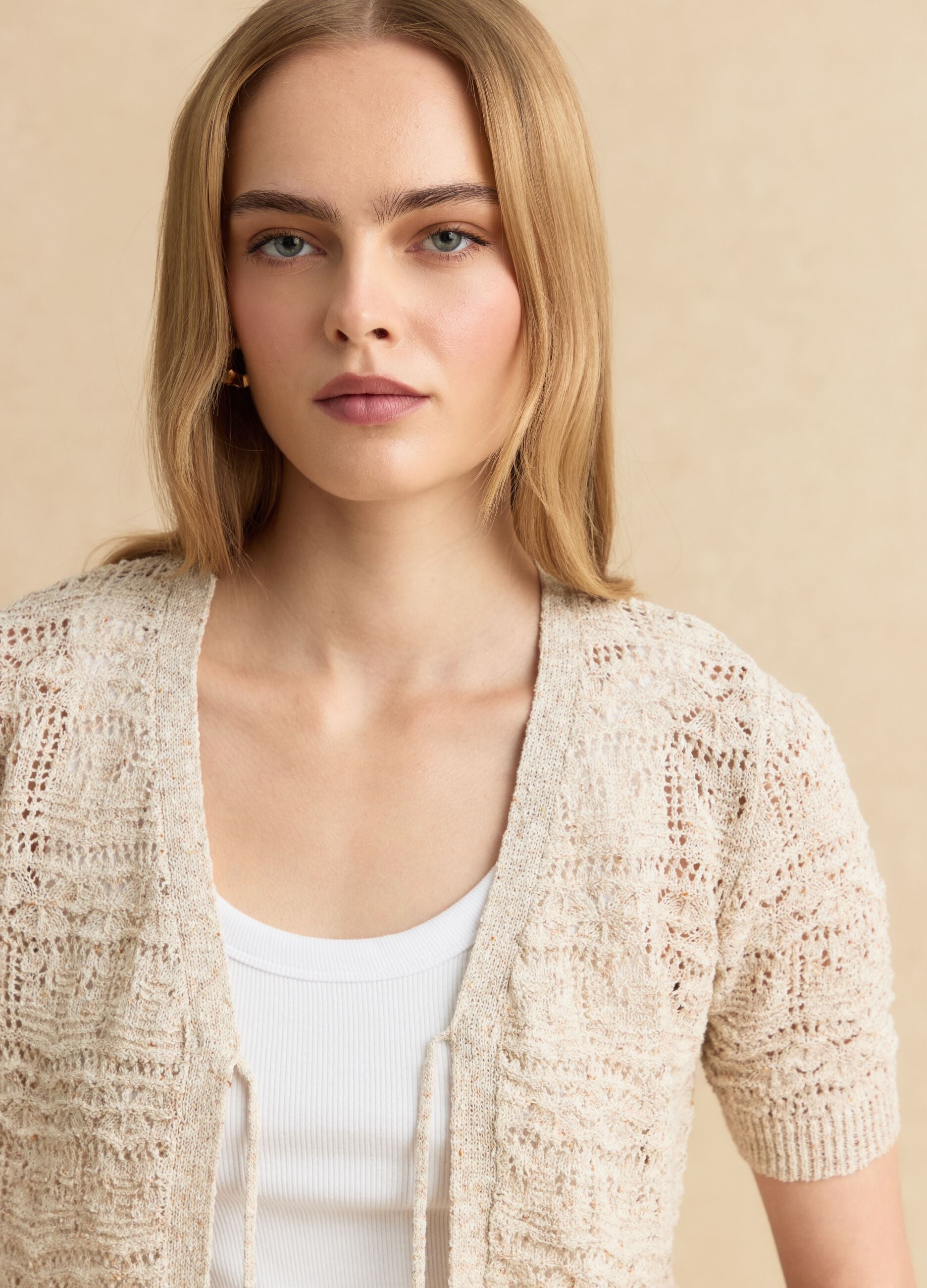Beige crochet-style cotton and linen blend cardigan with deep V-neck, regular fit