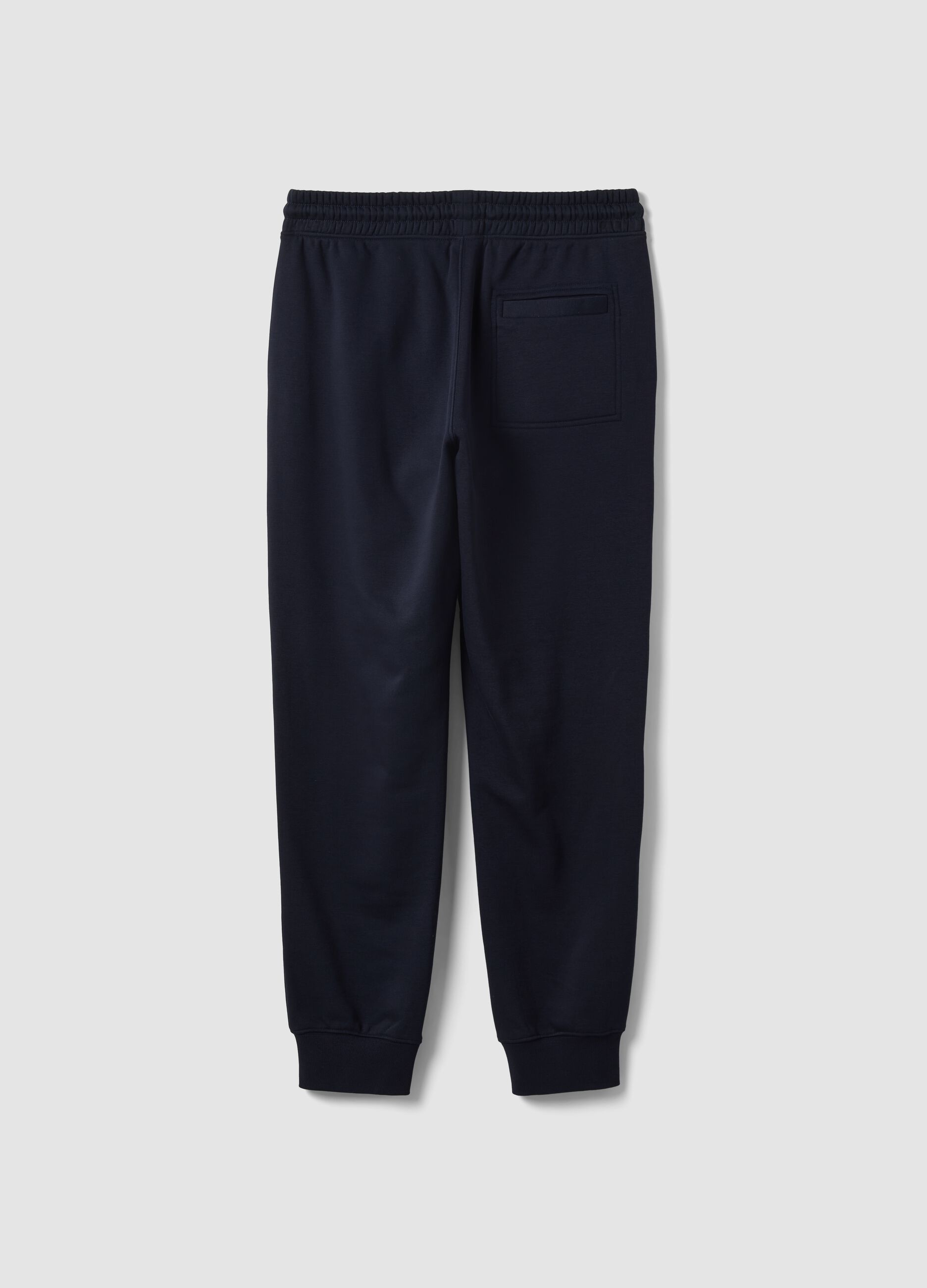 Blue cotton-blend joggers with cuffed hems and drawstring