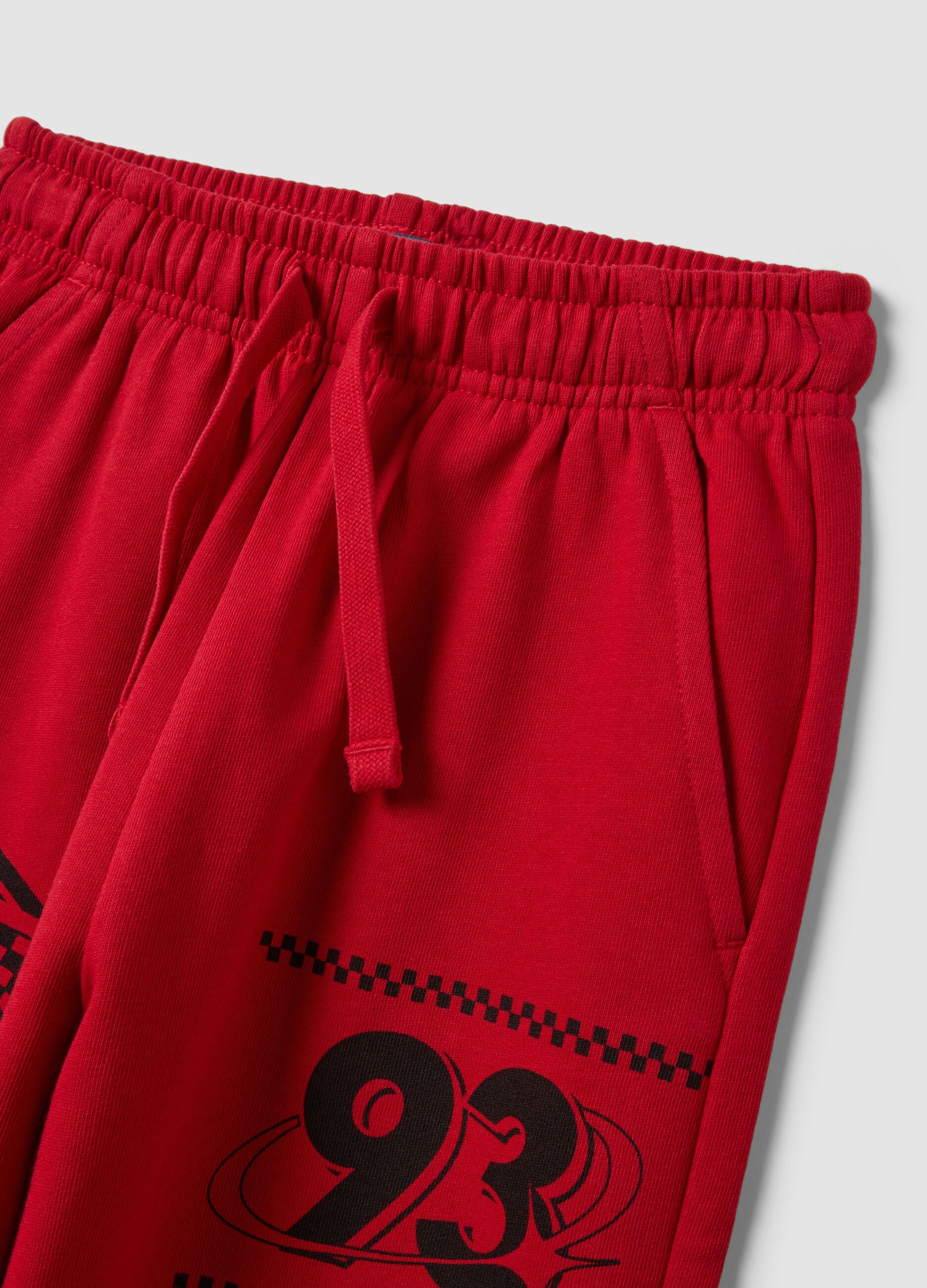 Red pure cotton jogger trousers with racing print
