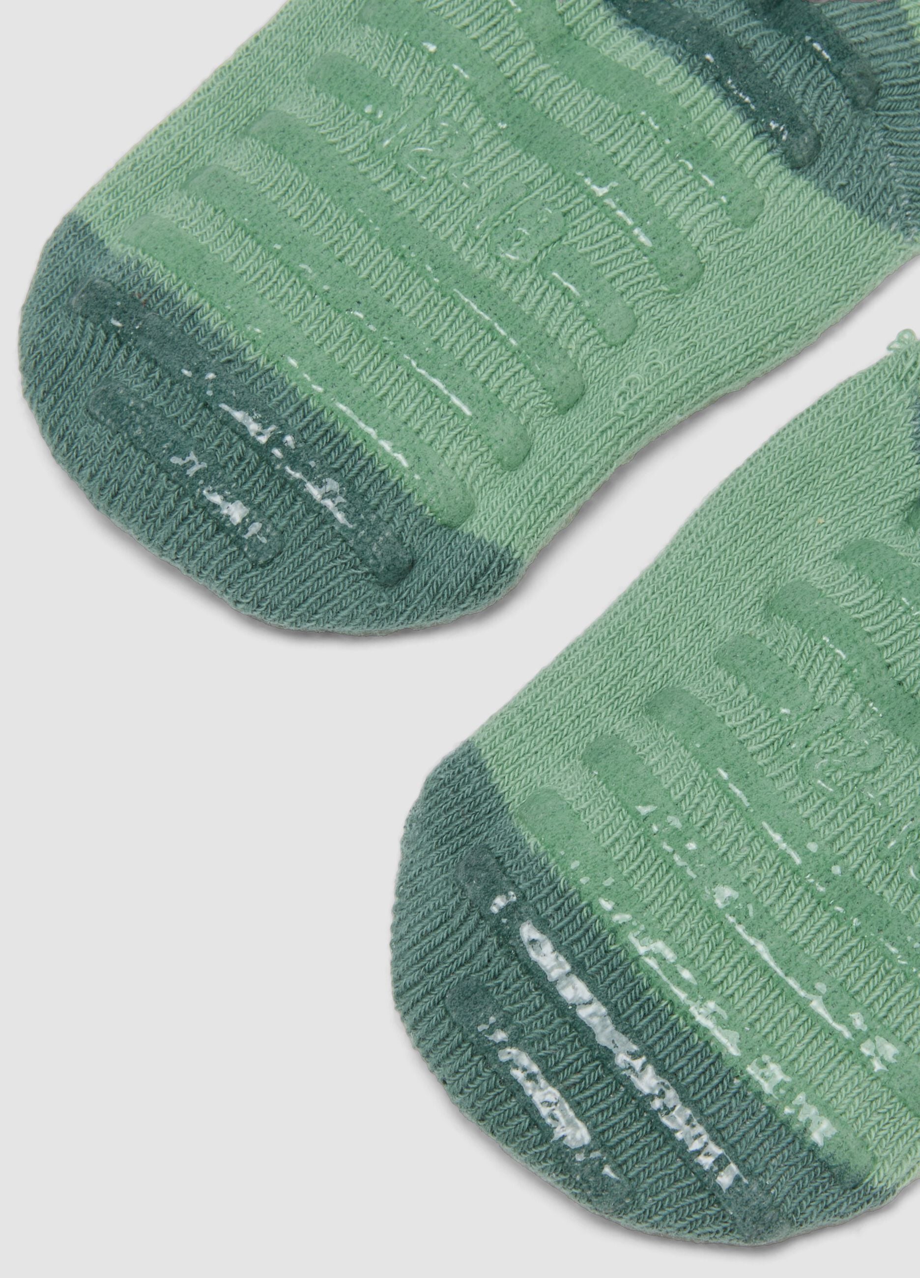 Green non-slip socks in organic stretch cotton with little car