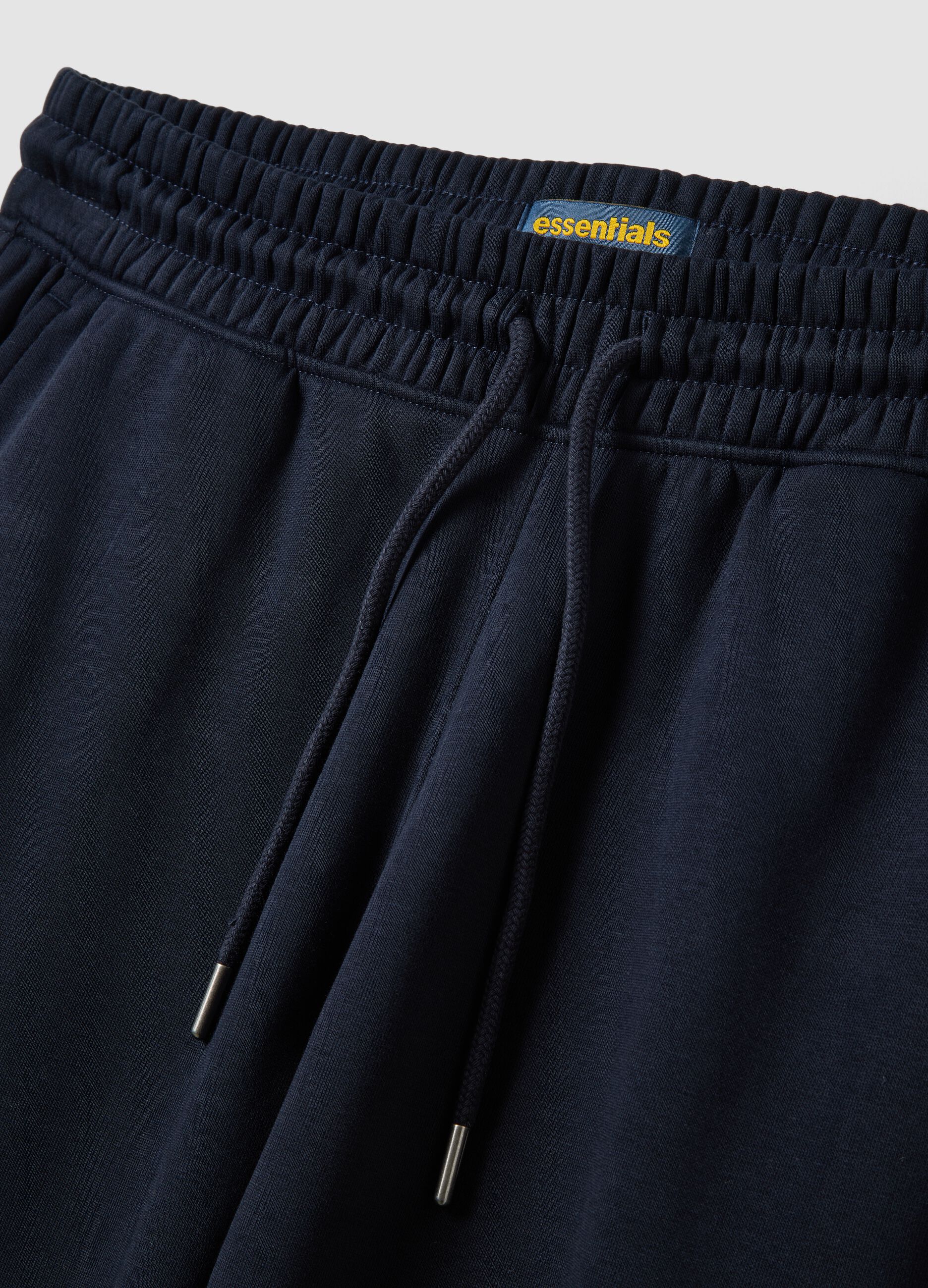 Blue cotton-blend joggers with cuffed hems and drawstring