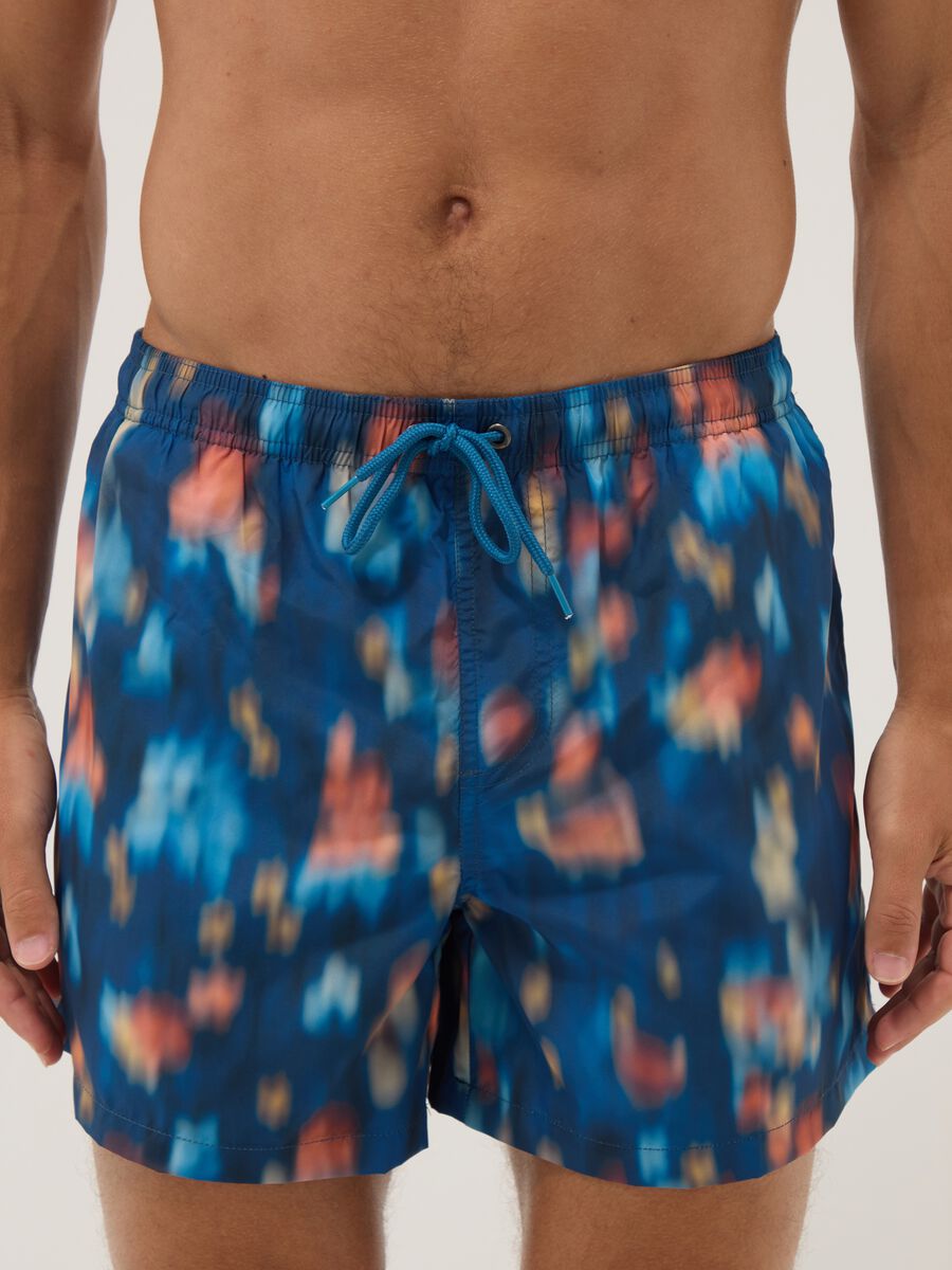 Blue boxer swim shorts with multicolour gradient print_1