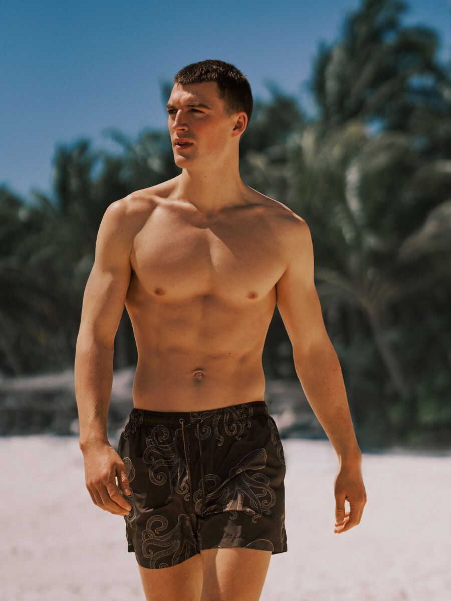 Brown swim shorts with all-over print_1