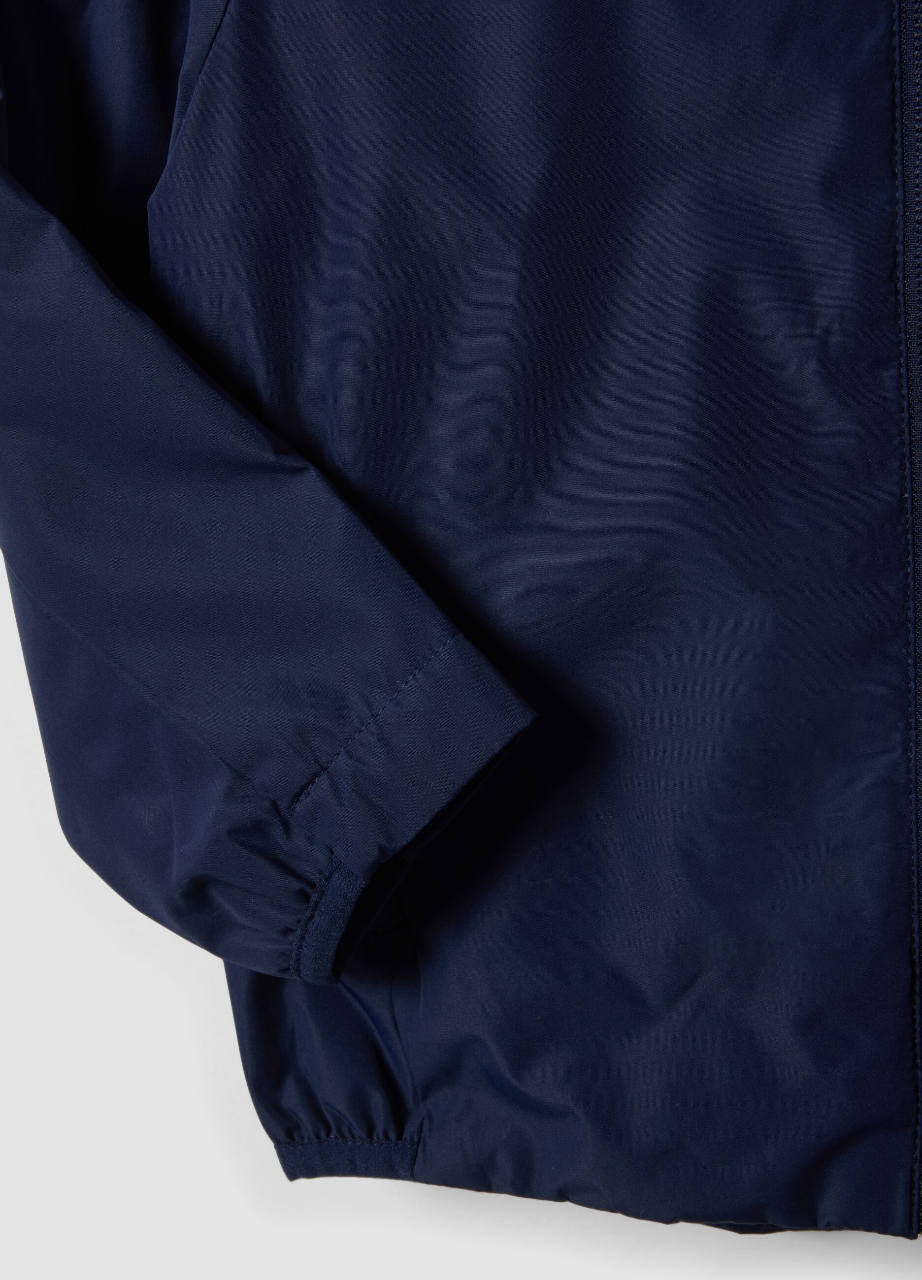 Blue kids&rsquo; rain jacket with hood and zip