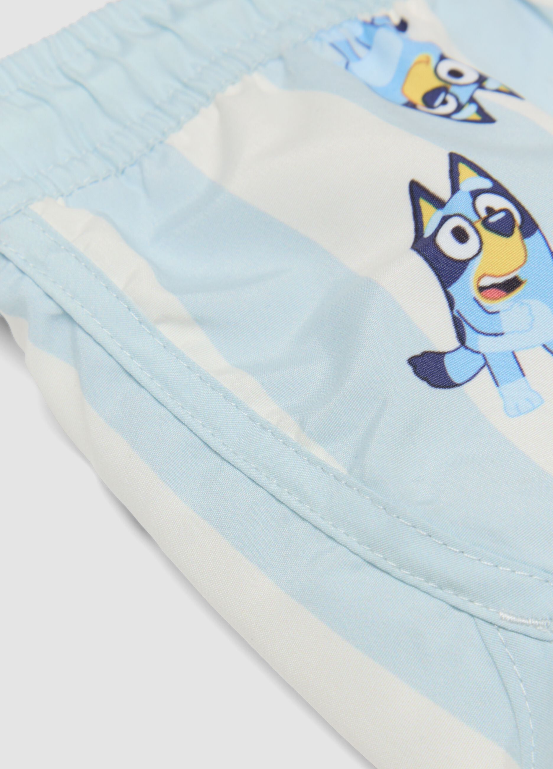 Light blue striped Bluey print swim shorts for boys