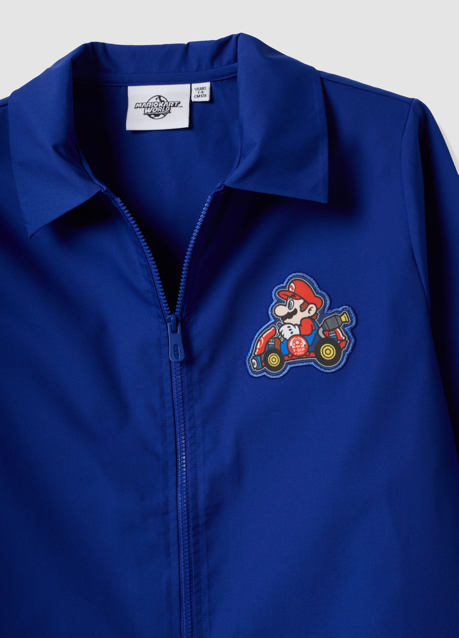 Blue boys&rsquo; school apron with zip and Mario Kart embroidery