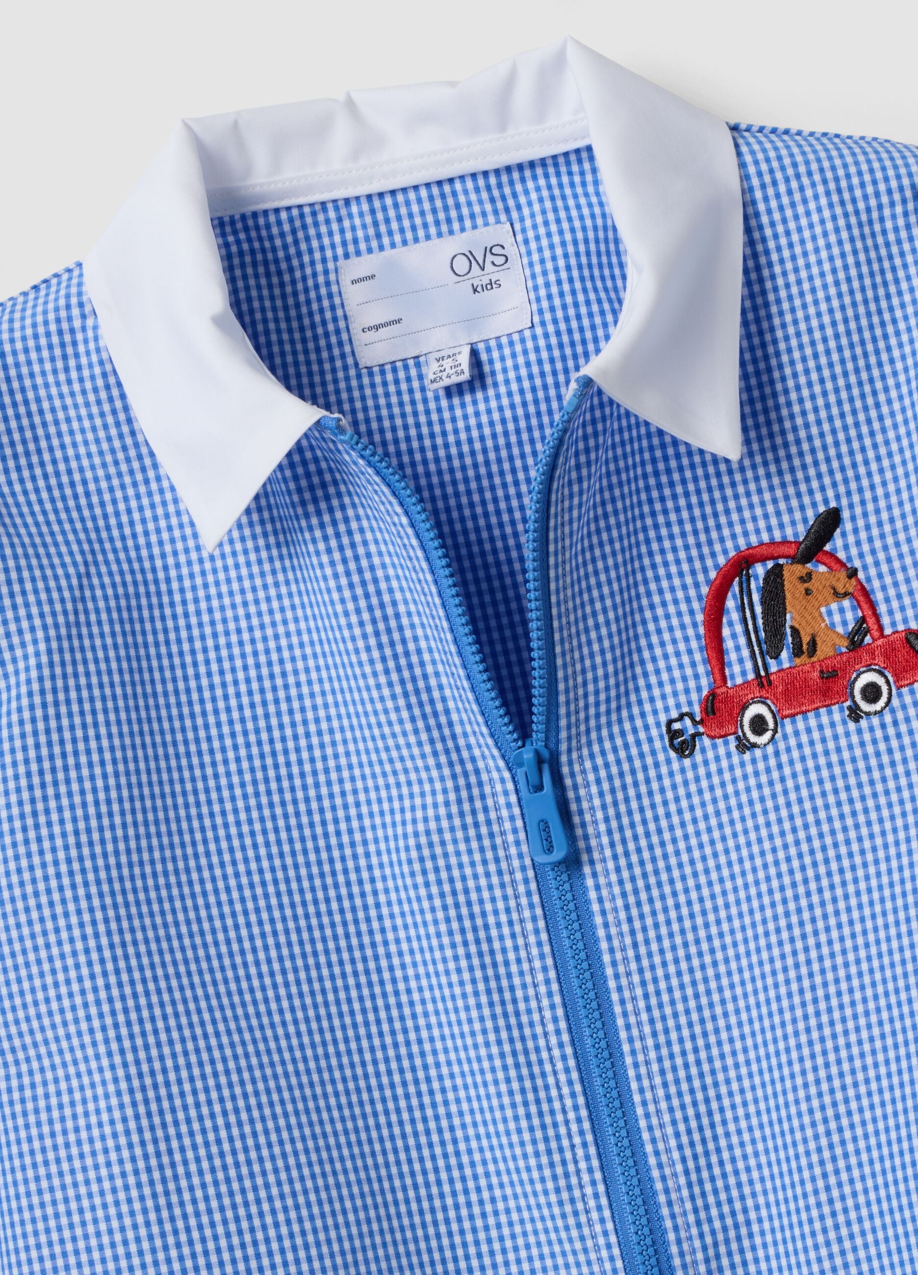 Customisable blue gingham nursery apron with machine embroidery