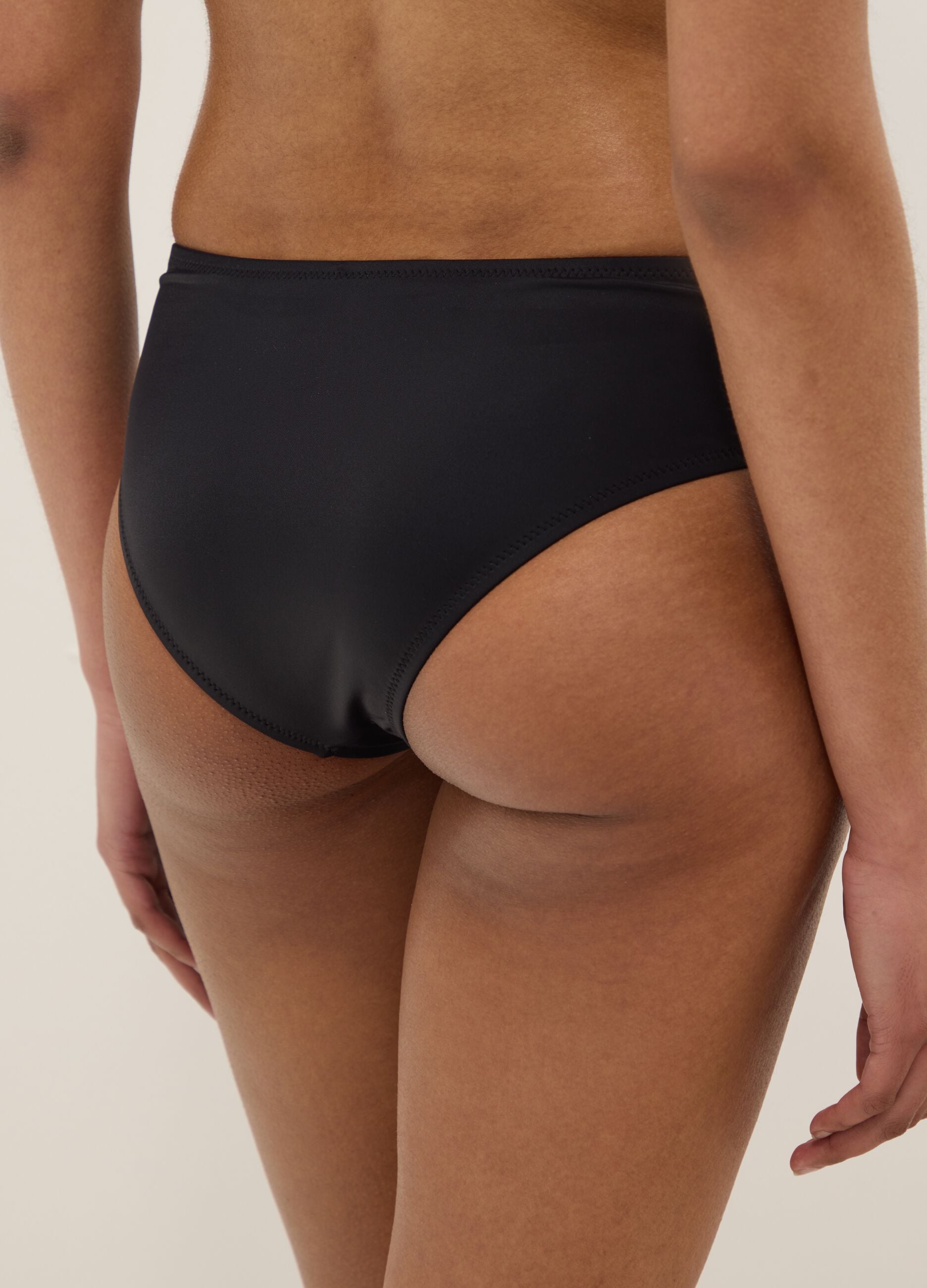 Black stretch swim briefs with side gathers
