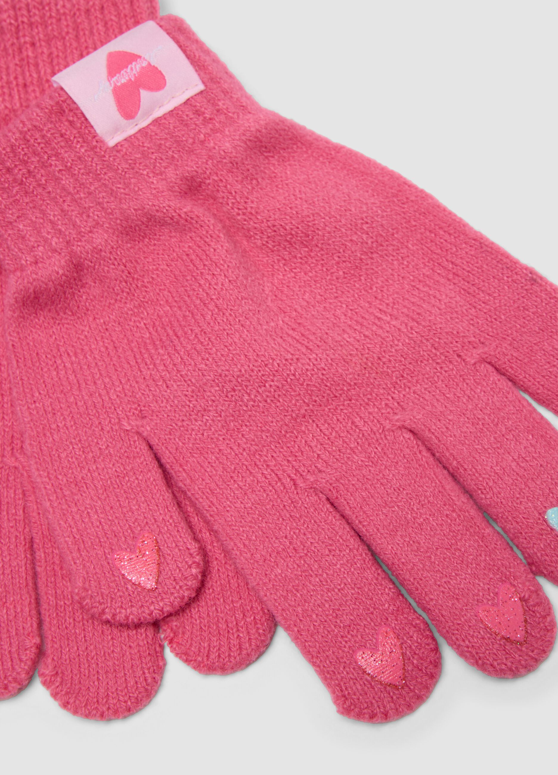 Pink knitted gloves with hearts