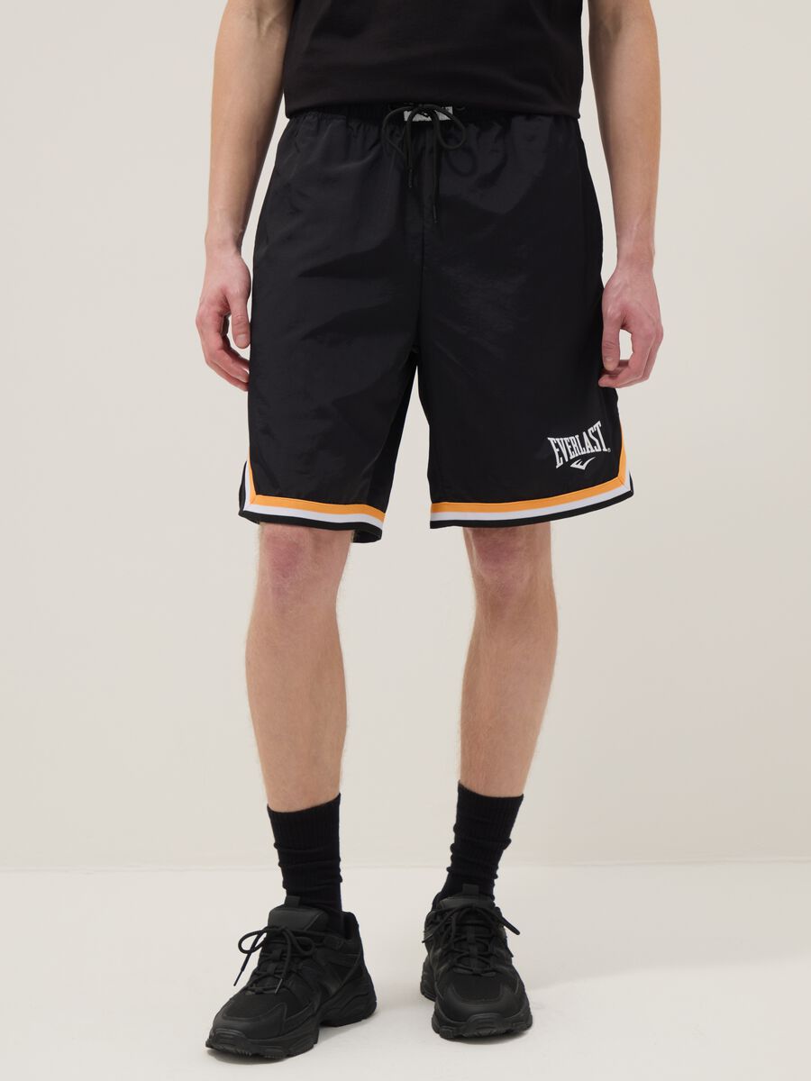 Regular fit black sports shorts with white and orange details_1