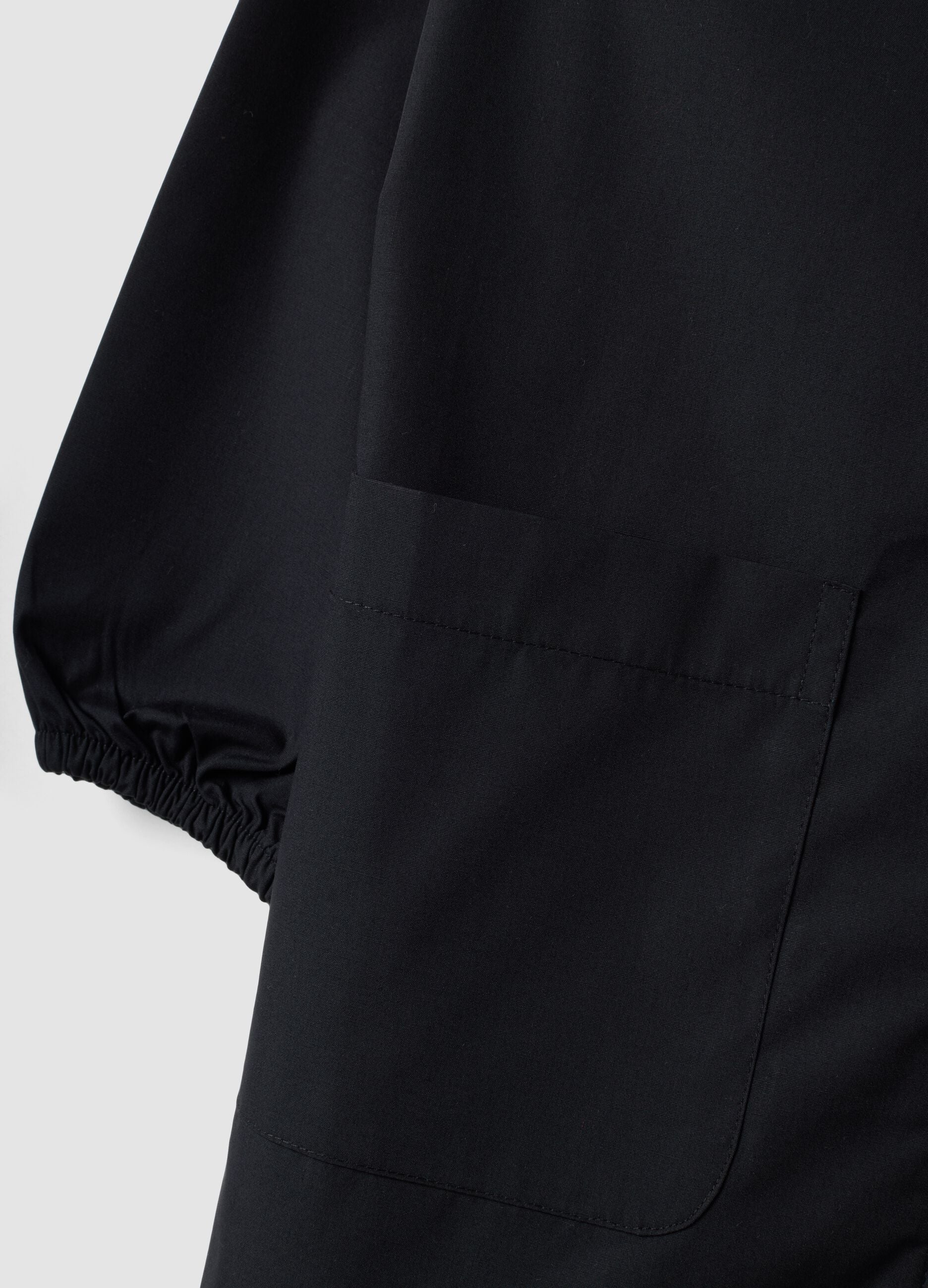 Customisable black school apron for girls with white collar