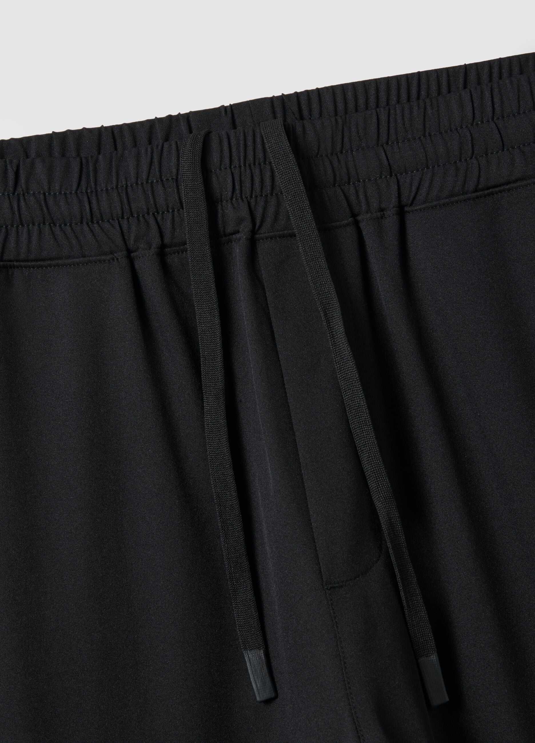 Black regular fit trousers with elasticated waist