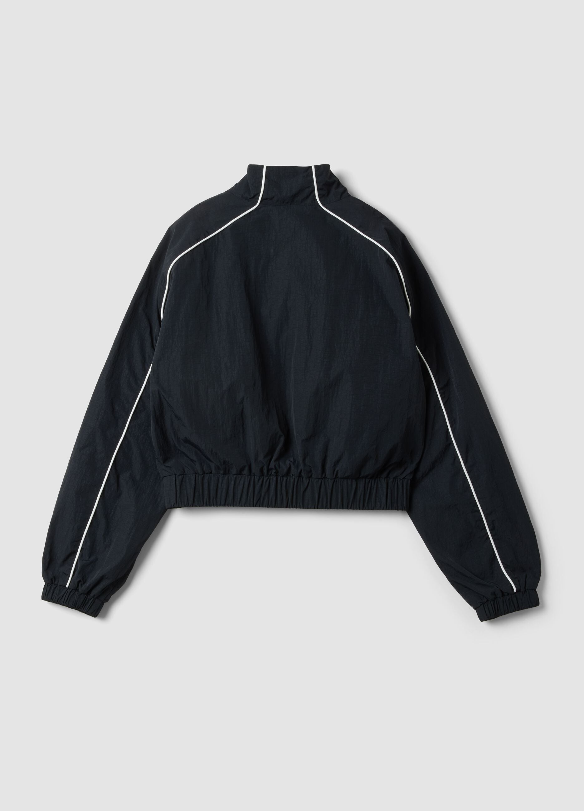 Black zip-up jacket with contrasting piping and high neck for girls