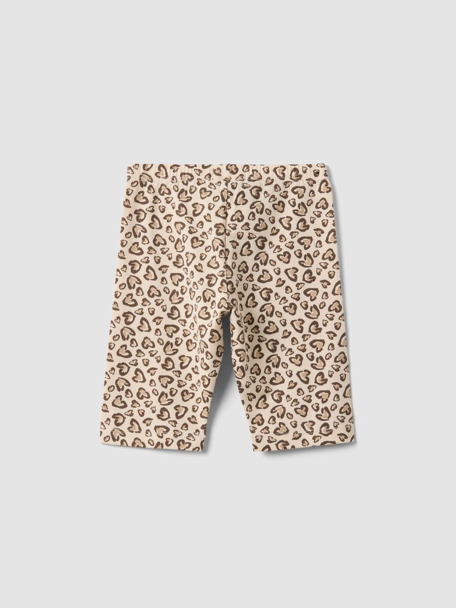 Beige organic cotton skinny cycling shorts with heart print for girls_1