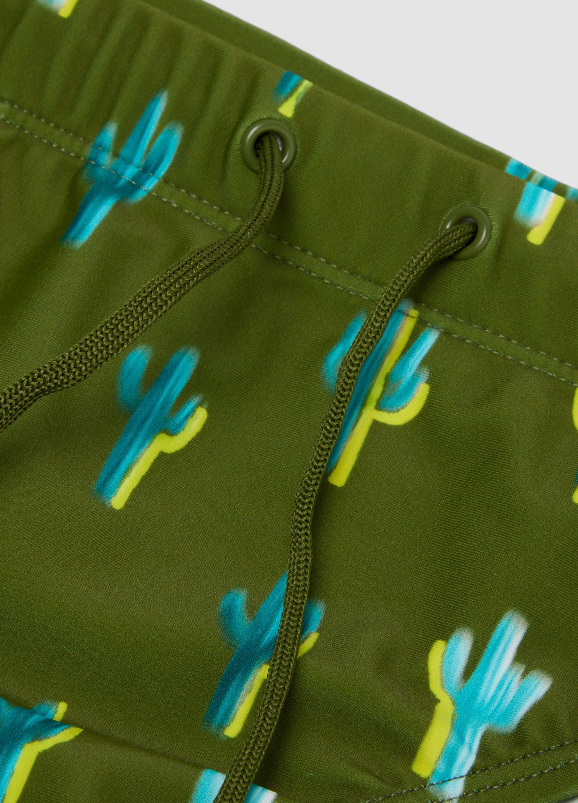 Green stretch-fabric swim briefs